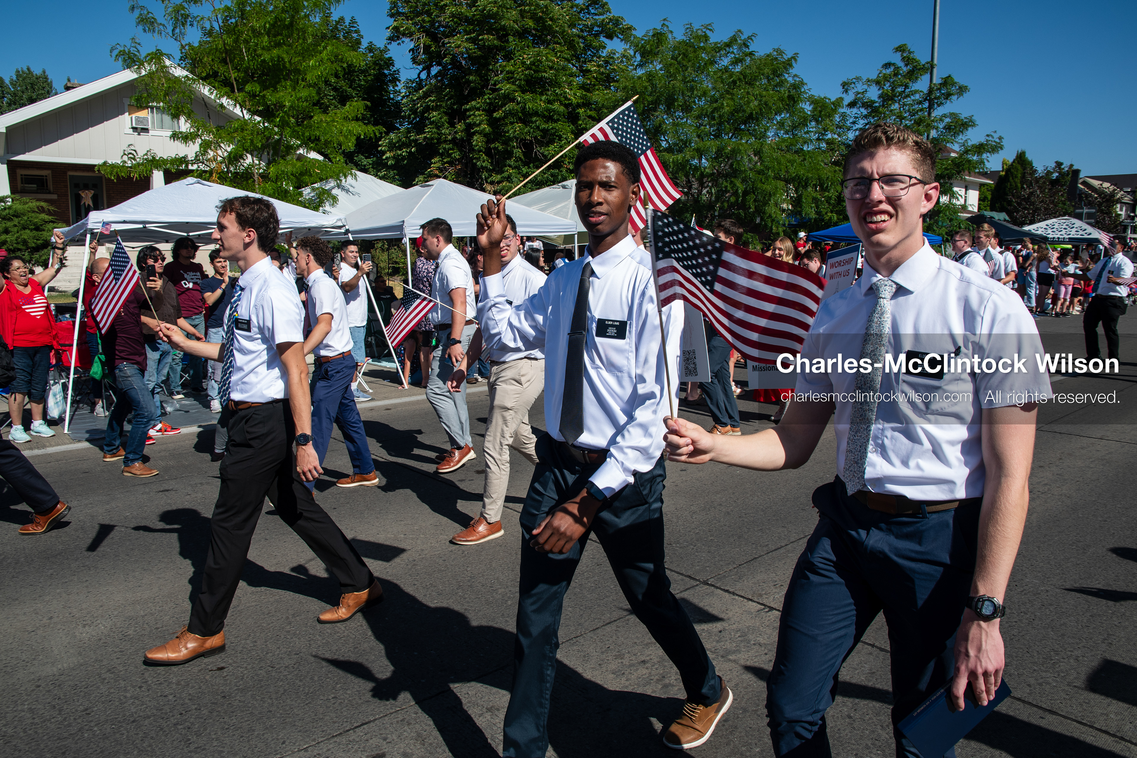 July 4, 2026, Provo, Utah, USA: Missionaries from The Church of Jesus Christ of Latter-day Saints wear black name badges and wave American flags while marching down the street during America's Freedom Festival Grand Parade in Provo, Utah, Saturday, July 4, 2026. The annual Independence Day event features expanded programming to honor the 250th anniversary of United States independence. (Credit Image: © Charles-McClintock Wilson/ZUMA Press Wire)
