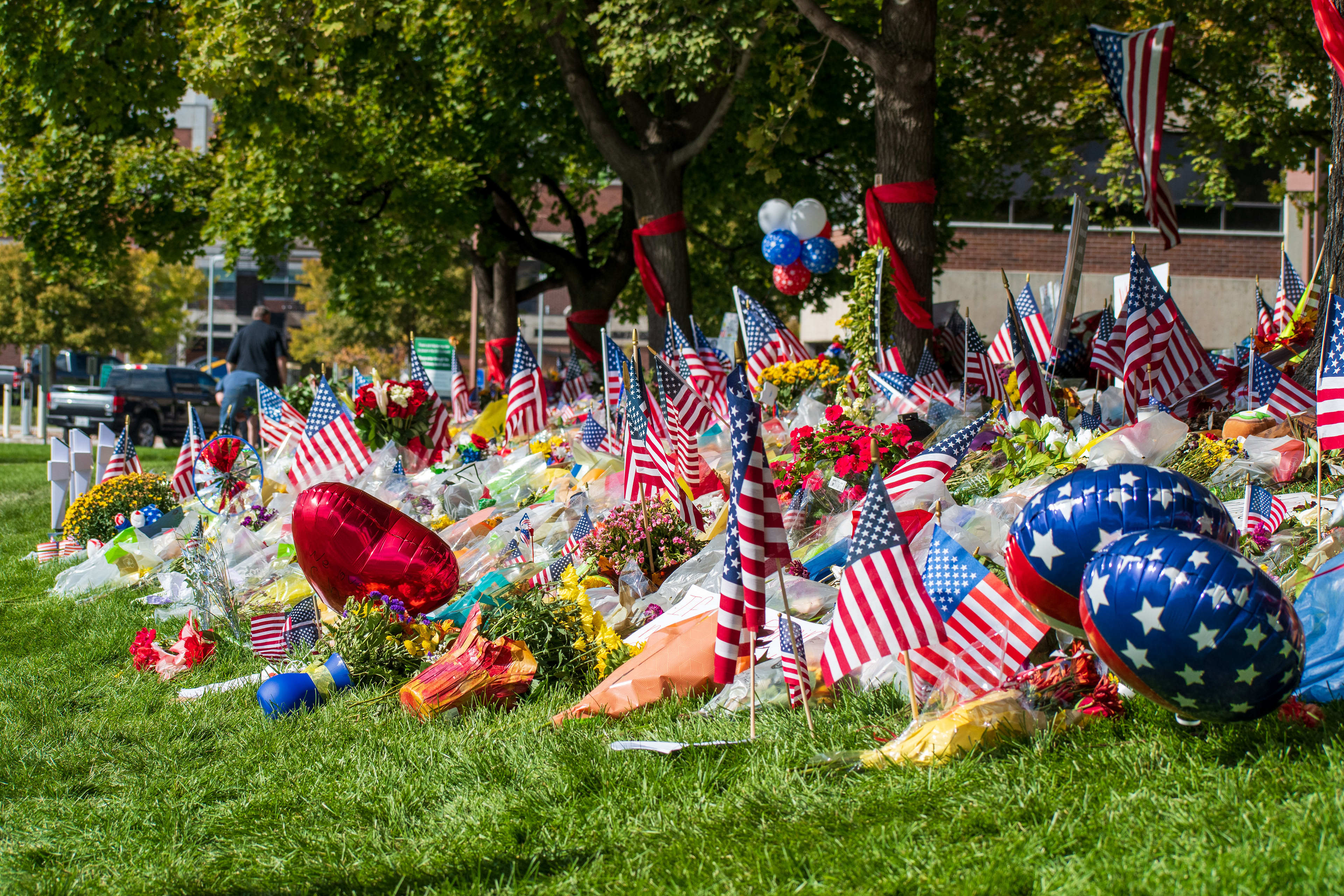 OREM, UTAH – SEPTEMBER 15, 2025: A memorial honoring Charlie Kirk is seen on the campus of Utah Valley University, featuring American flags, candles, flowers, and handwritten signs arranged around a large portrait. The tribute appeared days after Kirk’s final public event at the university. © Charles‑McClintock Wilson / ZUMA Press