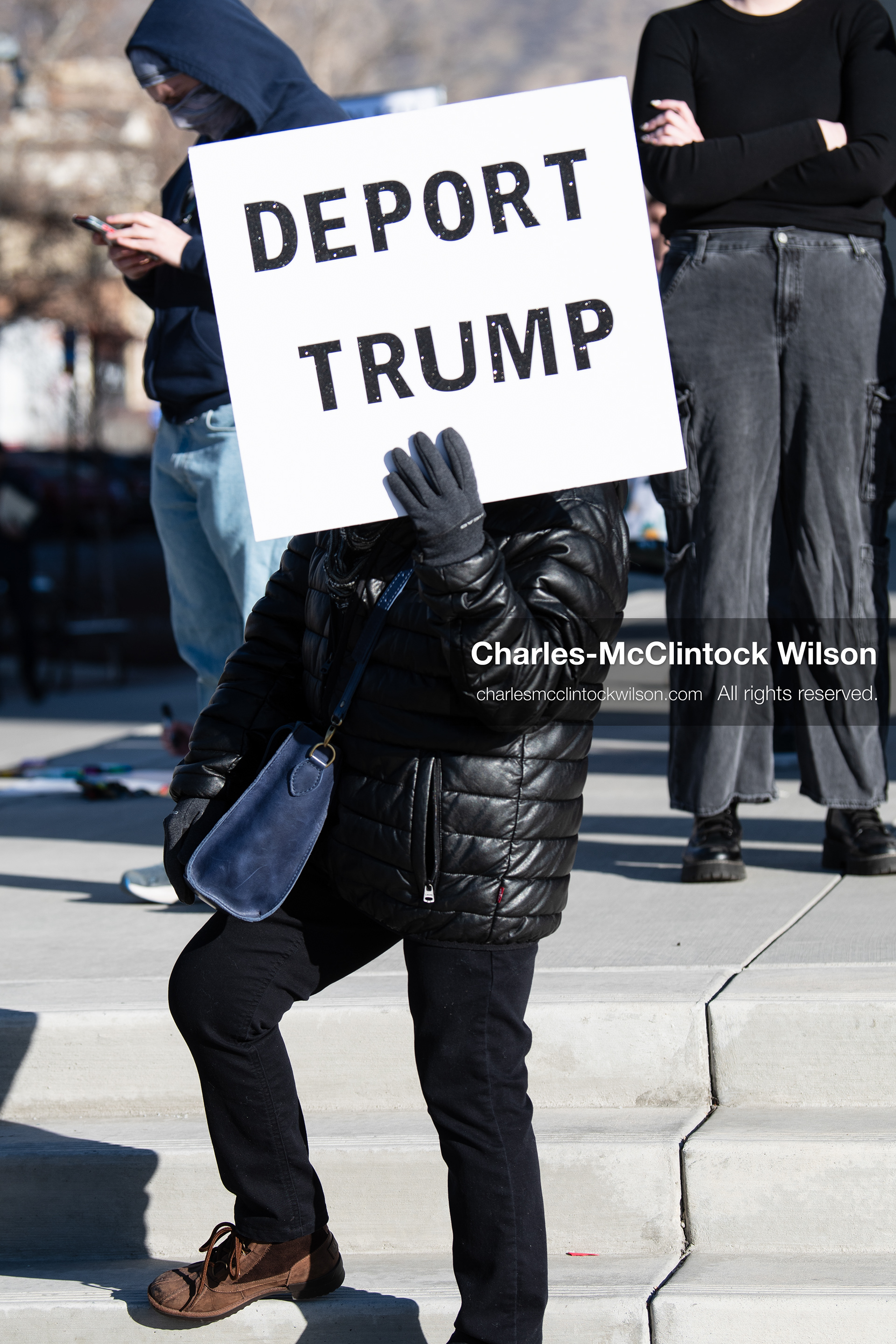January 20, 2026, Provo, Utah, USA: A demonstrator stands outside Provo City Hall during the Free America Walkout protest in Provo Utah on January 20 2026. The nationwide event called for immigration reform and changes to detention practices. 