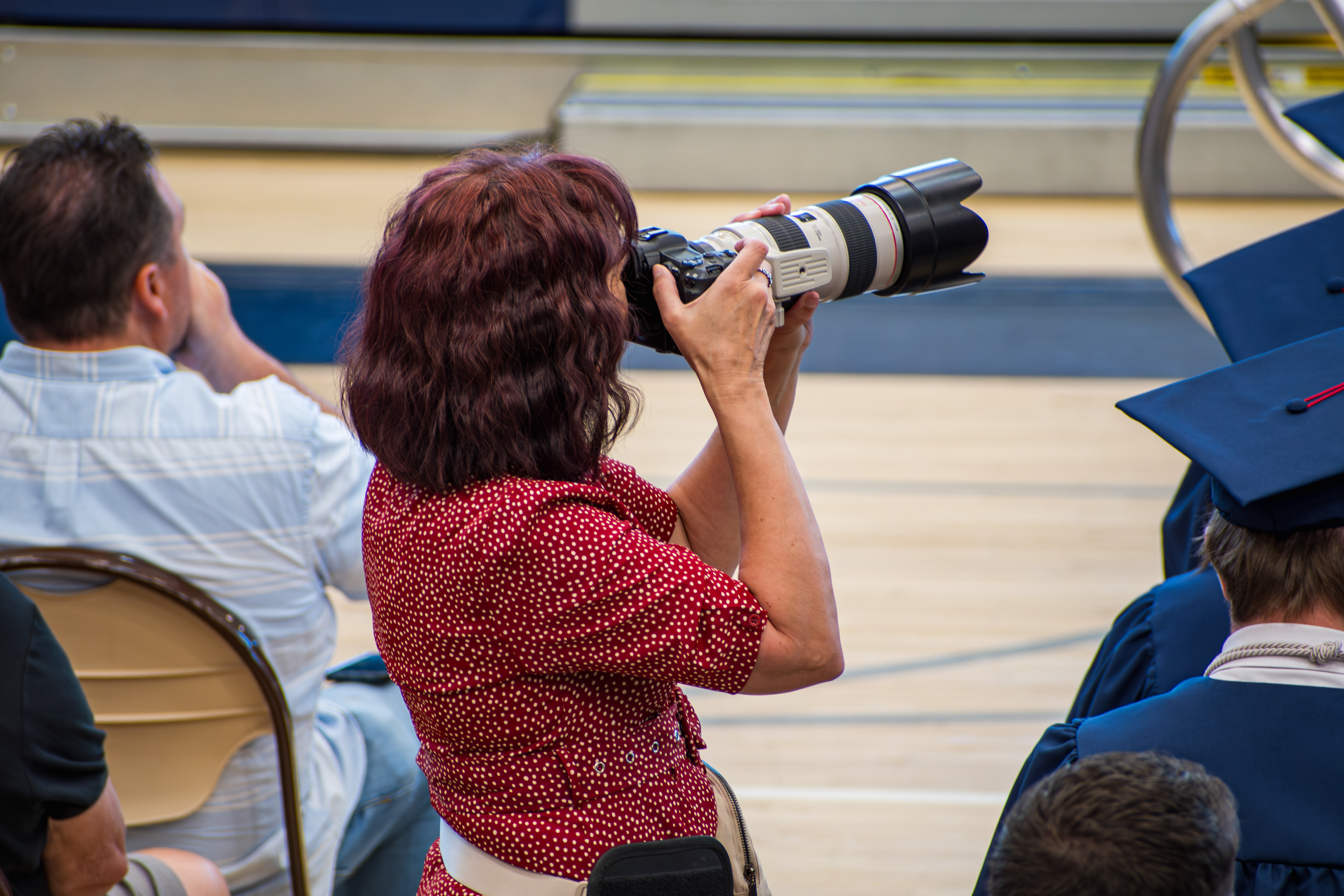  American Fork, UT, USA – May 24, 2025: A photojournalist documents a graduation ceremony at an academy in American Fork, Utah.