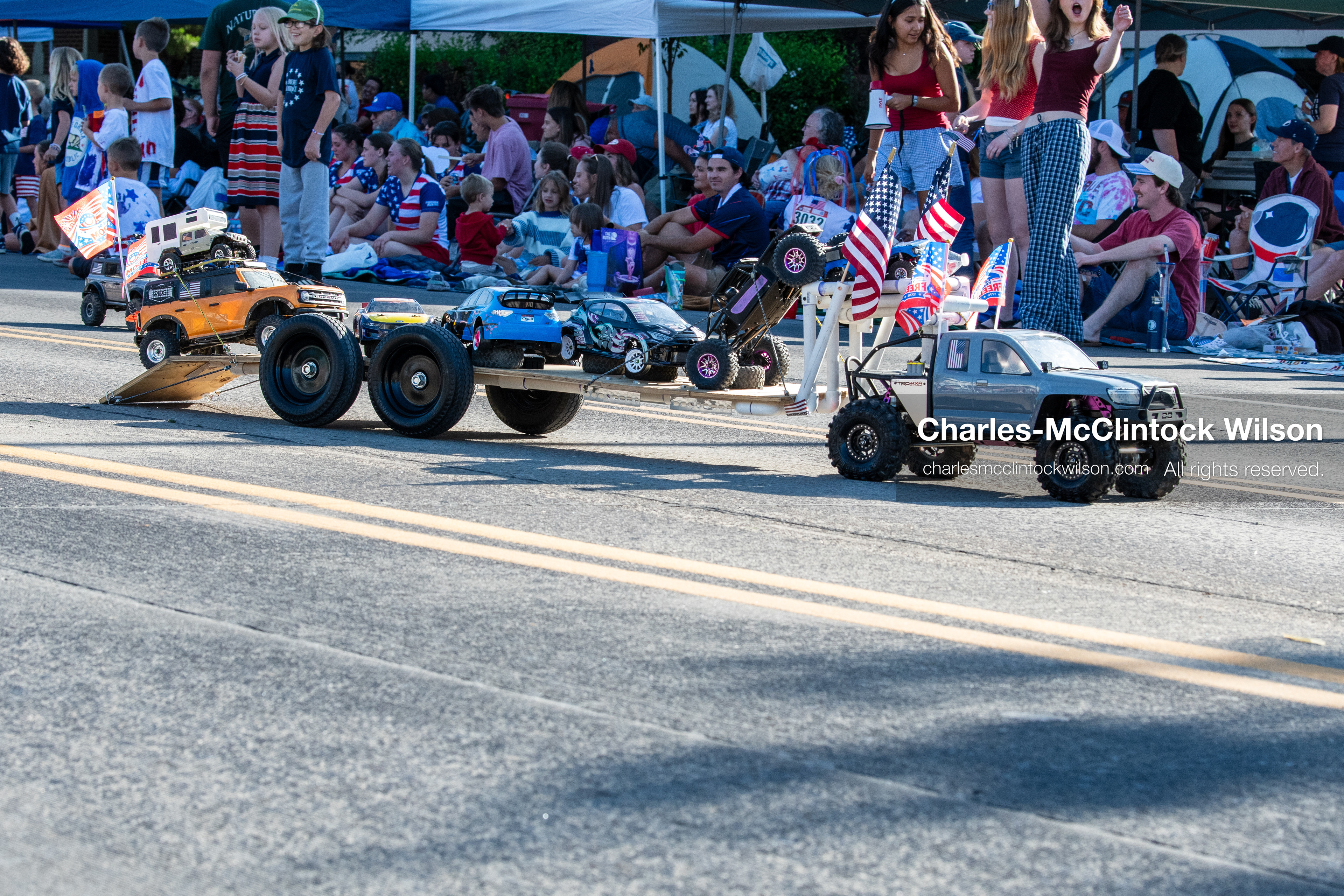 July 4, 2026, Provo, Utah, USA: A remote-controlled pickup truck decorated with small American flags tows a trailer carrying a second RC vehicle down the street during America's Freedom Festival Grand Parade in Provo, Utah, Saturday, July 4, 2026. The annual Independence Day event features expanded programming to honor the 250th anniversary of United States independence. (Credit Image: © Charles-McClintock Wilson/ZUMA Press Wire)
