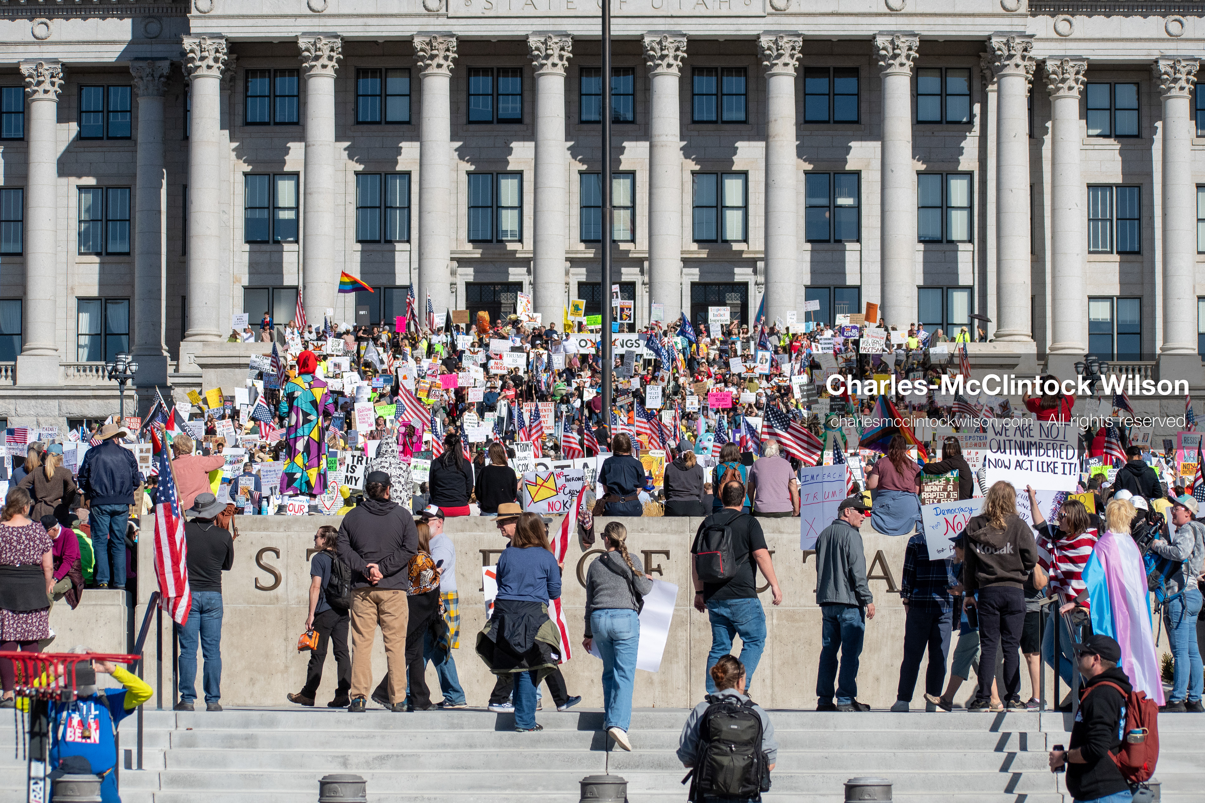 October 18, 2025, Salt Lake City, Utah, USA: Demonstrators participate in a "No Kings" protest held at the Utah State Capitol. Participants hold signs and flags during the public gathering.