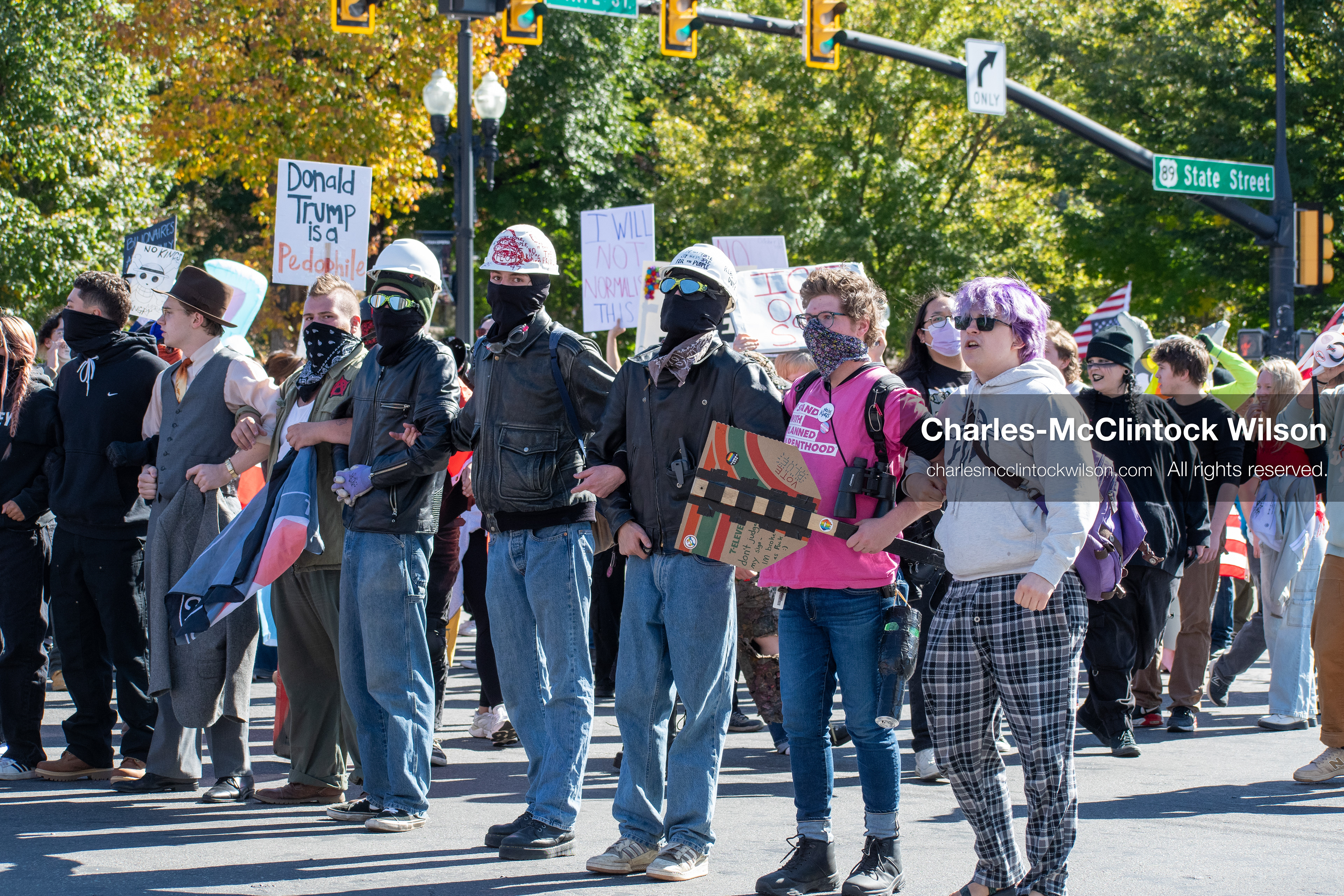 October 18, 2025, Salt Lake City, Utah, USA: Demonstrators link arms during a "No Kings" protest on South State Street in Salt Lake City, Utah. The protest was part of a nationwide mobilization.