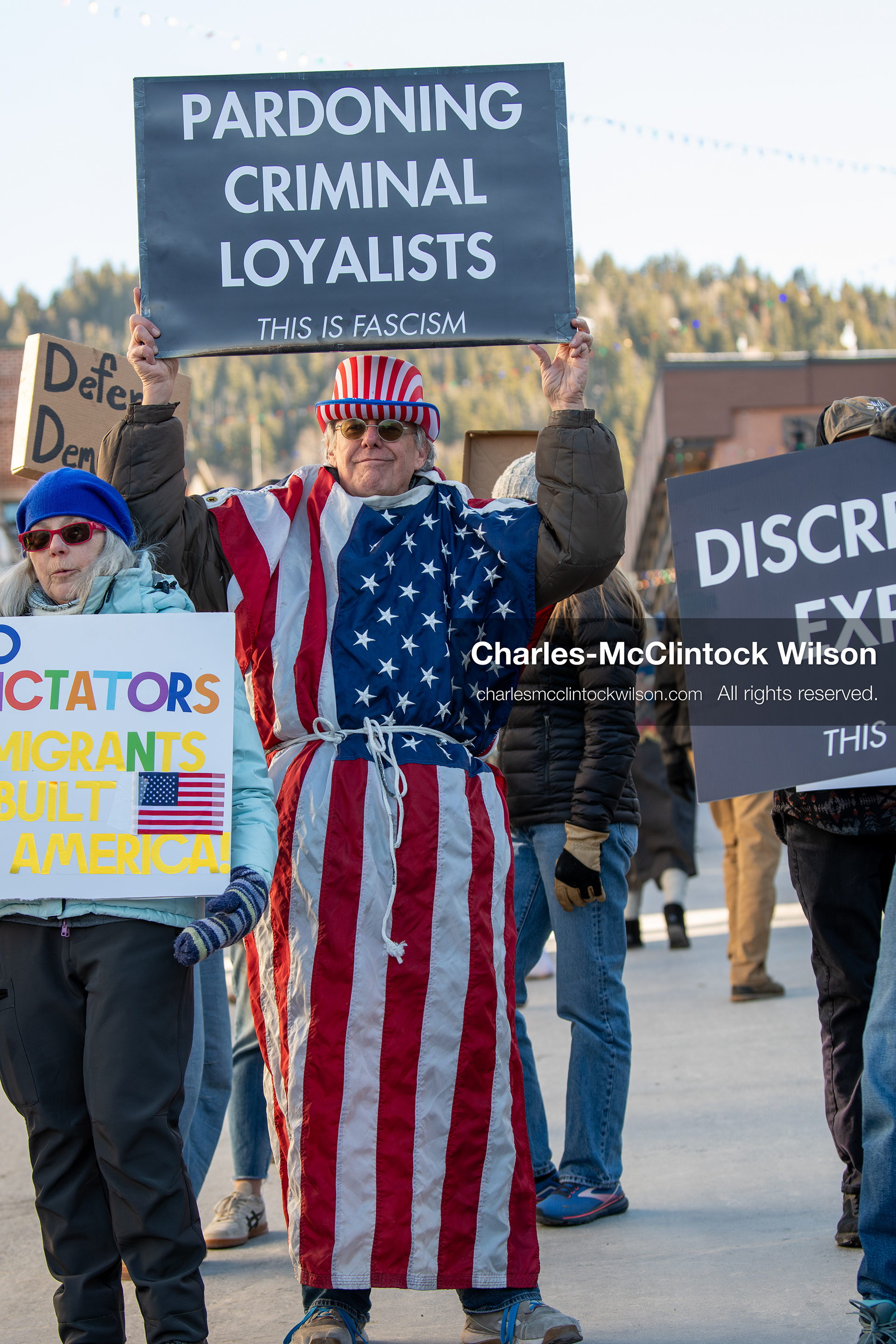 January 26, 2026, Park City, Utah, USA: A demonstrator dressed in an American flag-themed outfit holds a sign while participating in a protest opposing U.S. Immigration and Customs Enforcement (I.C.E.) ICE agents at the Sundance Film Festival in Park City, Utah, on Monday, Jan. 26, 2026. The event was held in response to the fatal shooting of Alex Pretti by a U.S. Border Patrol officer in Minneapolis. (Credit Image: © Charles McClintock Wilson/ZUMA Press Wire)