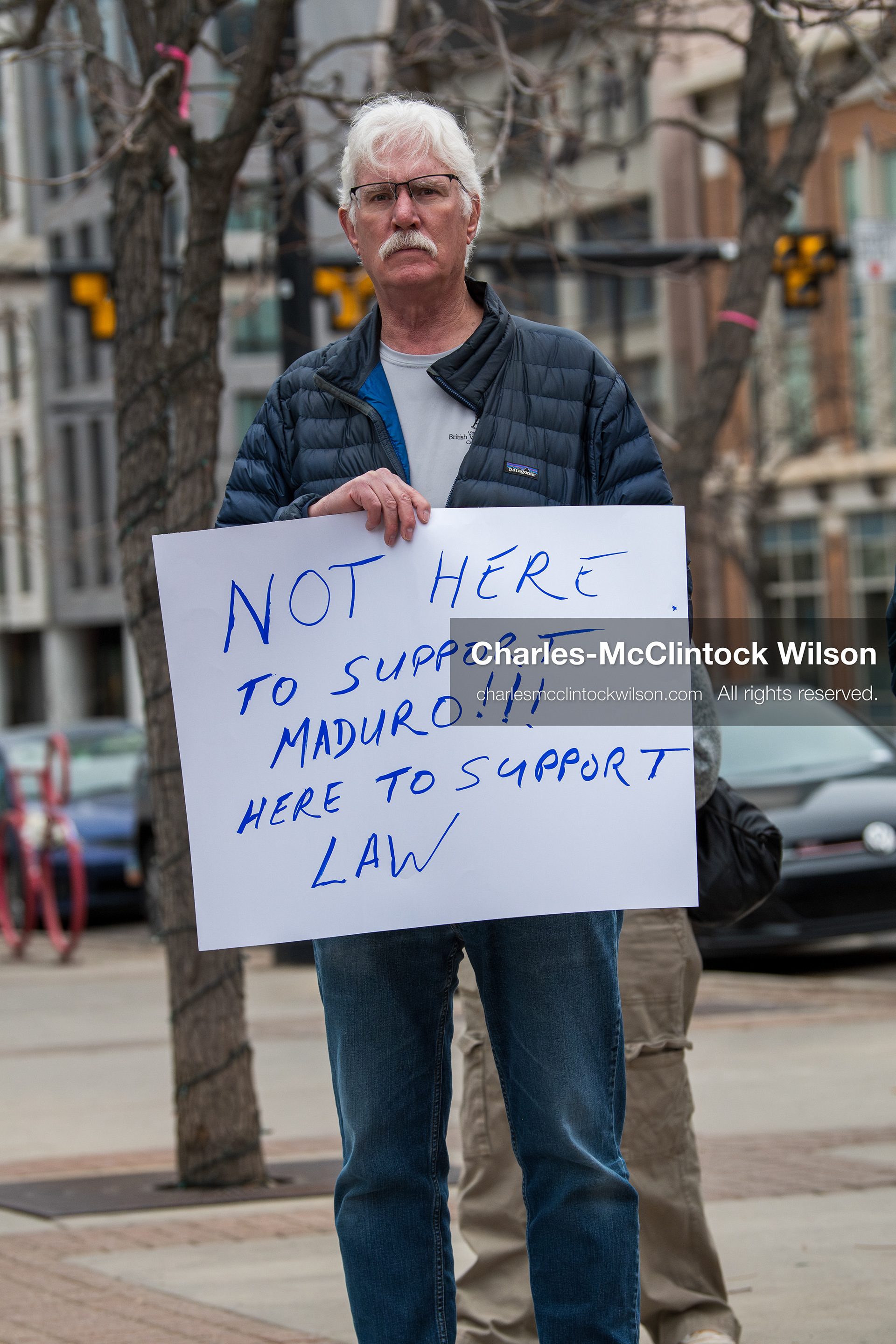 January 3, 2026, Salt Lake City, Utah, USA: A protester holds a sign during a demonstration against US action in Venezuela outside the Wallace Federal Building in Salt Lake City, Utah. The protest was part of a nationwide mobilization responding to recent military developments. (Credit Image: (c) Charles‑McClintock Wilson/ZUMA Press Wire)