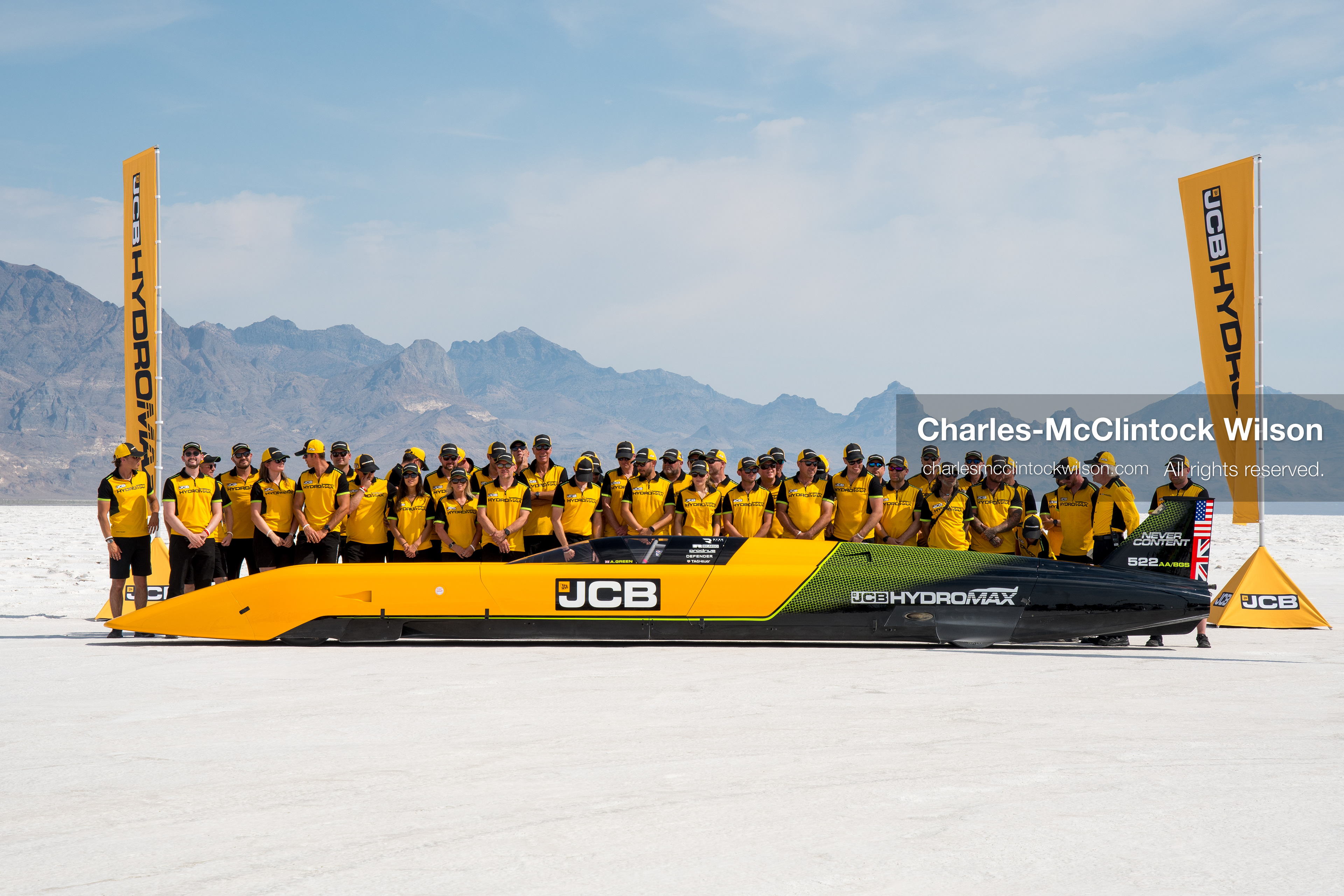 August 11, 2026, Wendover, Utah, USA: British pilot Andy Green and the JCB engineering team pose for a group photo behind the ''JCB Hydromax'' hydrogen-powered streamliner on the Bonneville Salt Flats on Tuesday. The team celebrated setting a new land speed record for a hydrogen vehicle, reaching a top speed of 406.320 mph. (Credit Image: © Charles McClintock Wilson/ZUMA Press Wire)