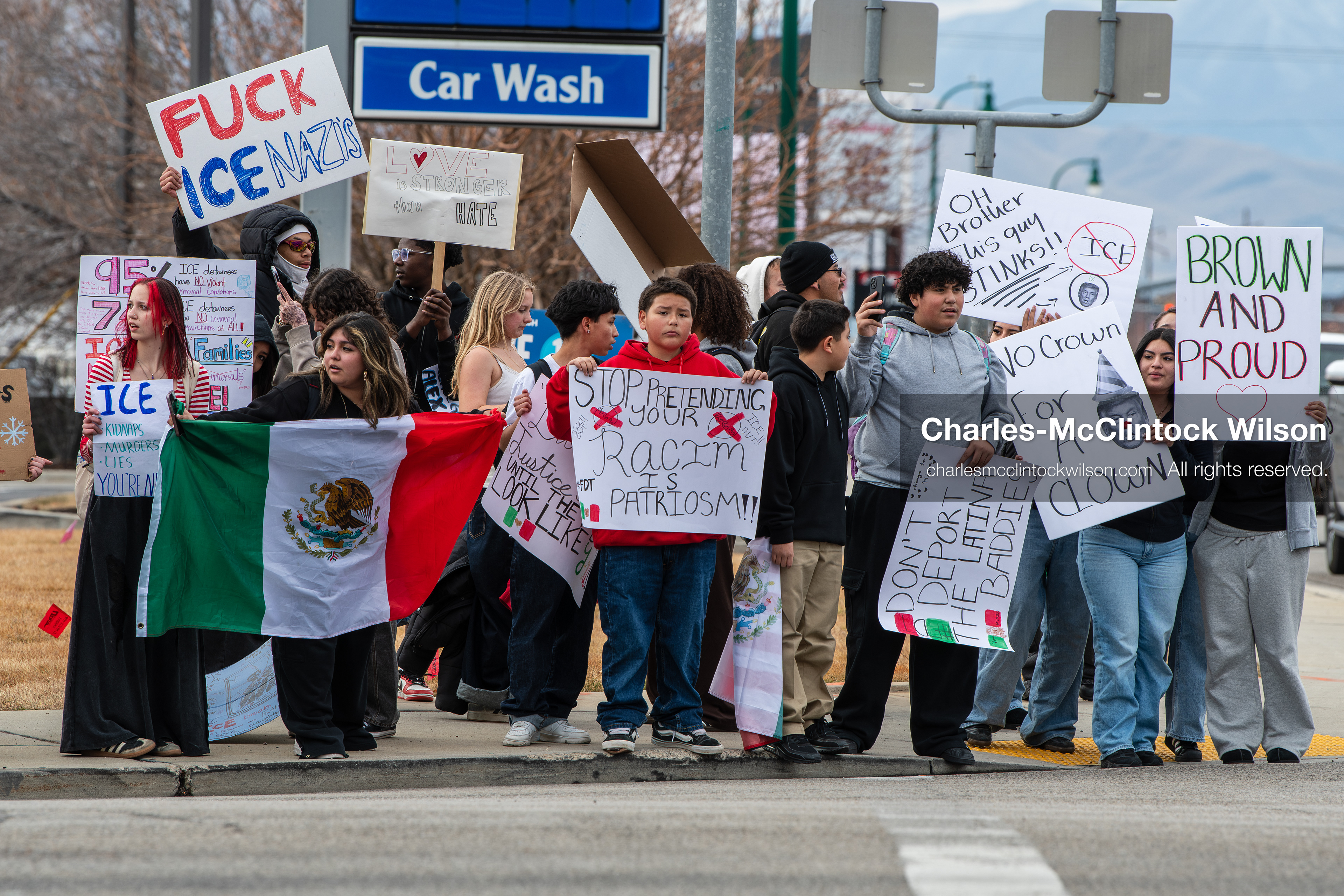 February 11, 2026, Orem, Utah, USA: Students stand on the sidewalk along State Street during a student‑led protest involving participants from multiple Orem schools. (Credit Image: © Charles‑McClintock Wilson/ZUMA Press Wire)