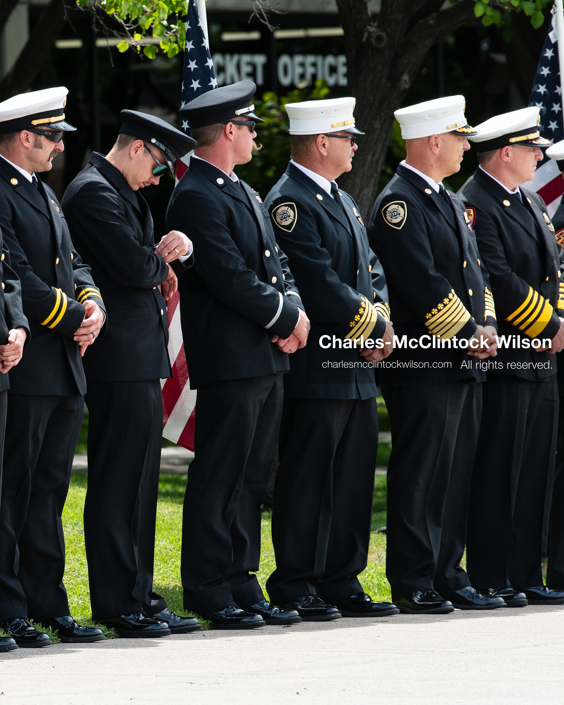 First responders stand in a solemn line during the public memorial ceremony outside the UCCU Center at Utah Valley University in Orem, Utah, on Wednesday, July 29, 2026. More than 300 people came to the public memorial ceremony to honor Provo Fire Captain Spencer Long, his wife Katrina, and three of their sons, who died after a flash flood hit their campsite near the Sunglow Campground in Wayne County. (Photo by Charles-McClintock Wilson/Sipa USA)
