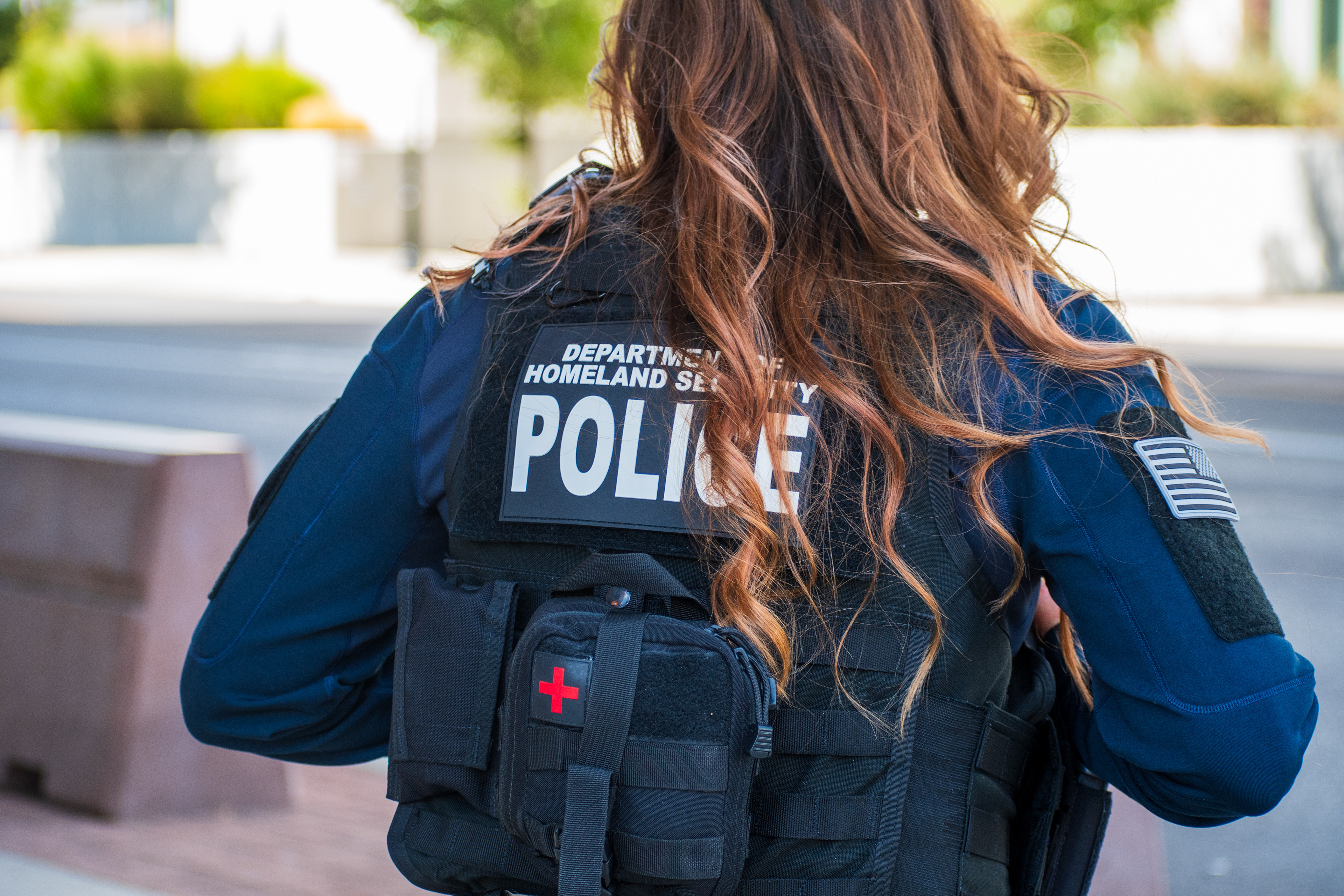 A Homeland Security police officer walks near the Utah Valley Convention Center during a Department of Homeland Security career expo focused on recruiting law enforcement and security personnel. Photograph by Charles‑McClintock Wilson / ZUMA Press Wire