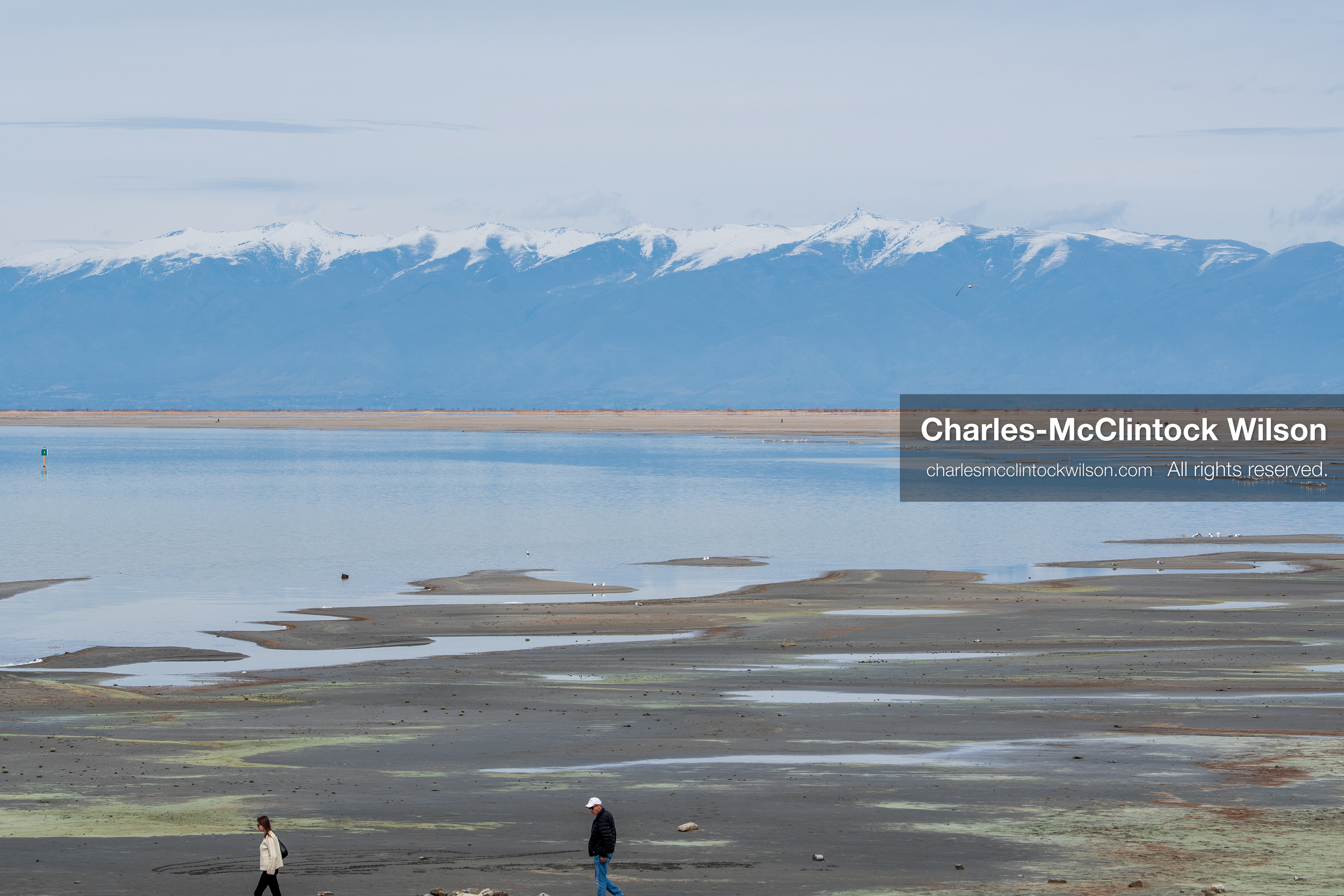 March 1, 2026, Great Salt Lake, Utah, USA: People walk along a path near the shoreline of the Great Salt Lake as the region continues to experience historically low water levels. Reports from state officials and the Great Salt Lake Strike Team state that the lake remains in a serious adverse‑effects range, with elevations among the lowest recorded in more than one hundred years. The lake has drawn increased public attention as lawmakers consider large‑scale water projects and long‑term plans to address declining conditions. (Credit Image: © Charles‑McClintock Wilson/ZUMA Press Wire)