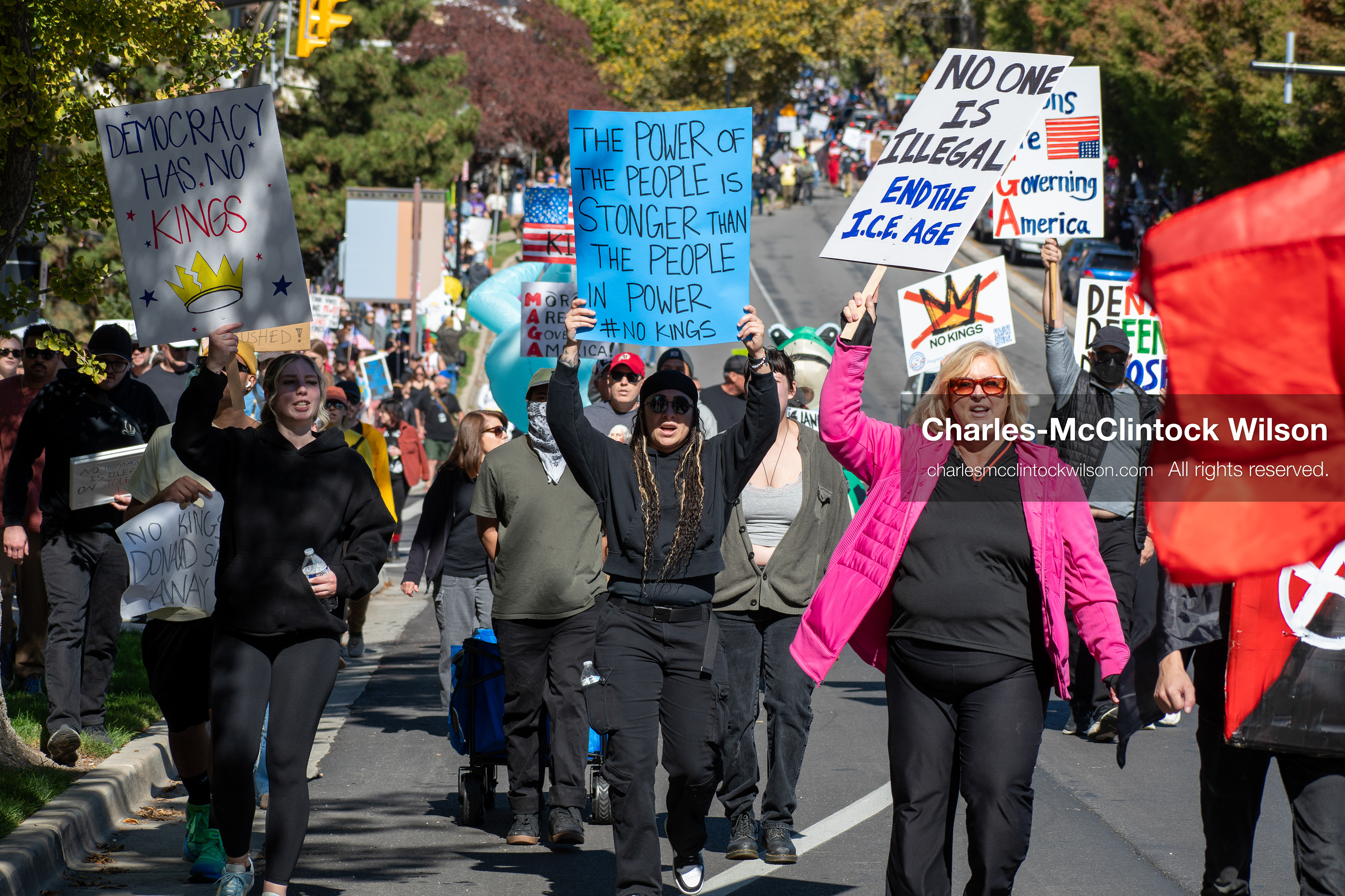 October 18, 2025, Salt Lake City, Utah, USA: Demonstrators march along South State Street during a "No Kings" protest in Salt Lake City, Utah. The protest was part of a nationwide mobilization.