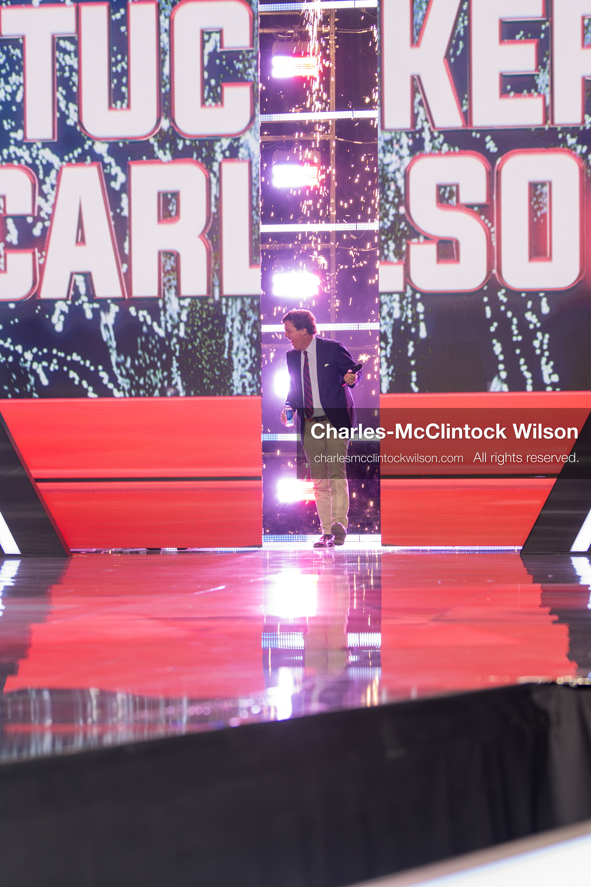 December 18, 2025, Phoenix, Arizona, USA: Tucker Carlson walks toward the stage on Day One of Turning Point USA’s AmericaFest 2025 at the Phoenix Convention Center in Phoenix, Arizona.   (Credit Image: © Charles‑McClintock Wilson/ZUMA Press Wire)