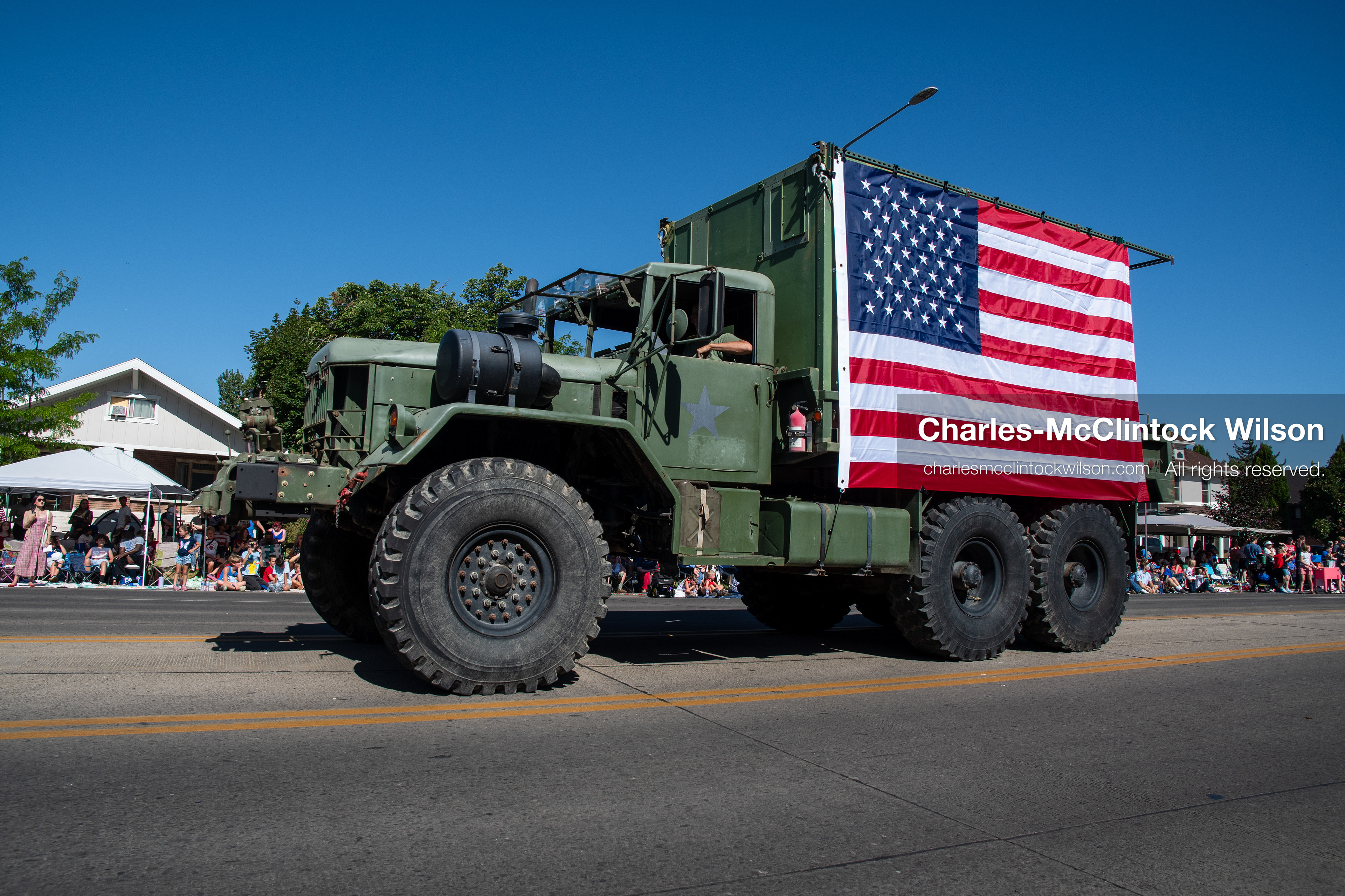 July 4, 2026, Provo, Utah, USA: A vintage military cargo truck draped with a large American flag drives along the route during America's Freedom Festival Grand Parade in Provo, Utah, Saturday, July 4, 2026. The annual Independence Day event features expanded programming to honor the 250th anniversary of United States independence. (Credit Image: © Charles-McClintock Wilson/ZUMA Press Wire)