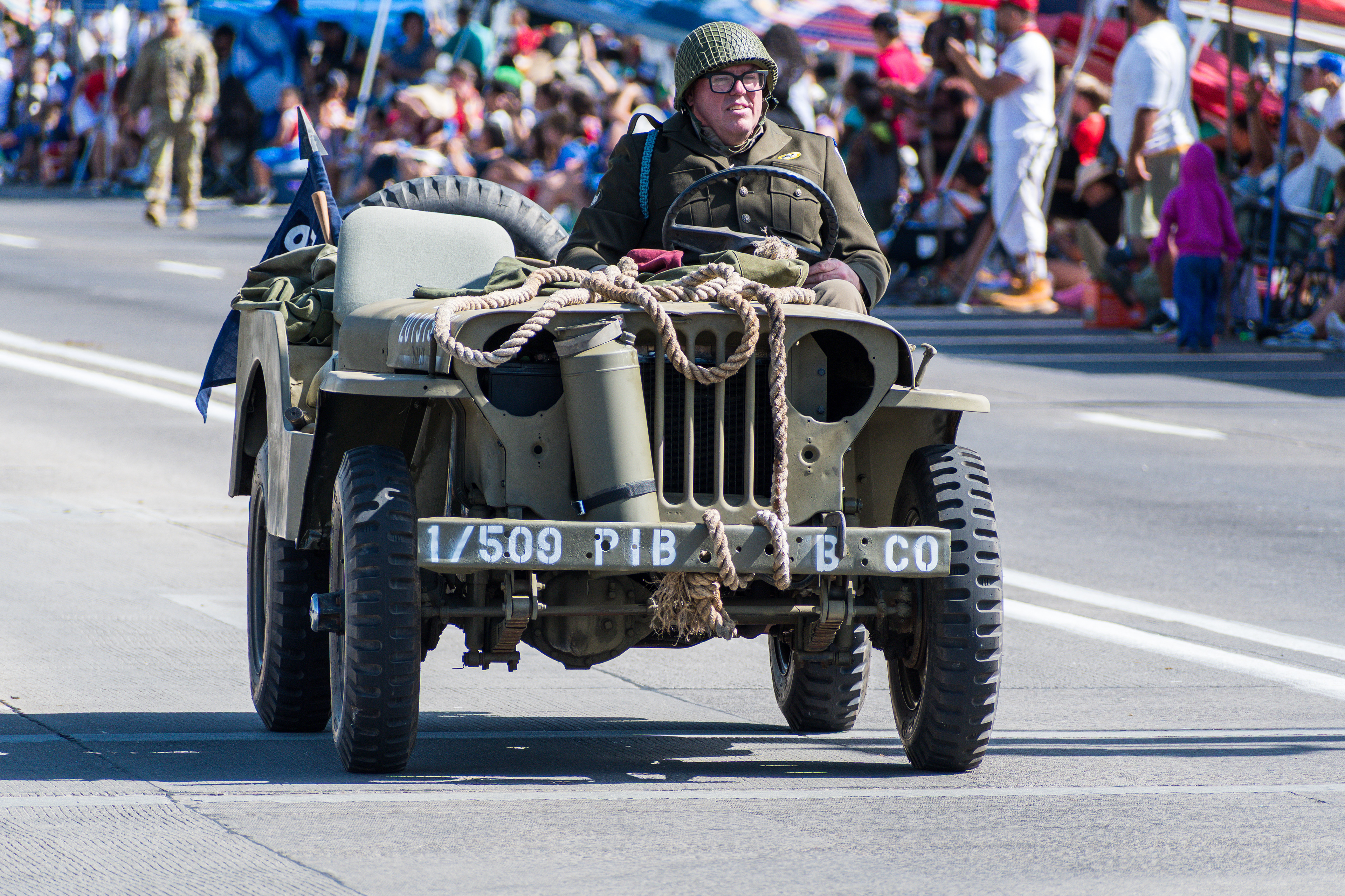 Provo, Utah – July 4, 2025: A reenactor in World War II-era uniform drives a restored jeep marked “1 509 PIB B CO” during the Grand Parade. The vehicle was part of a patriotic tribute to U.S. military