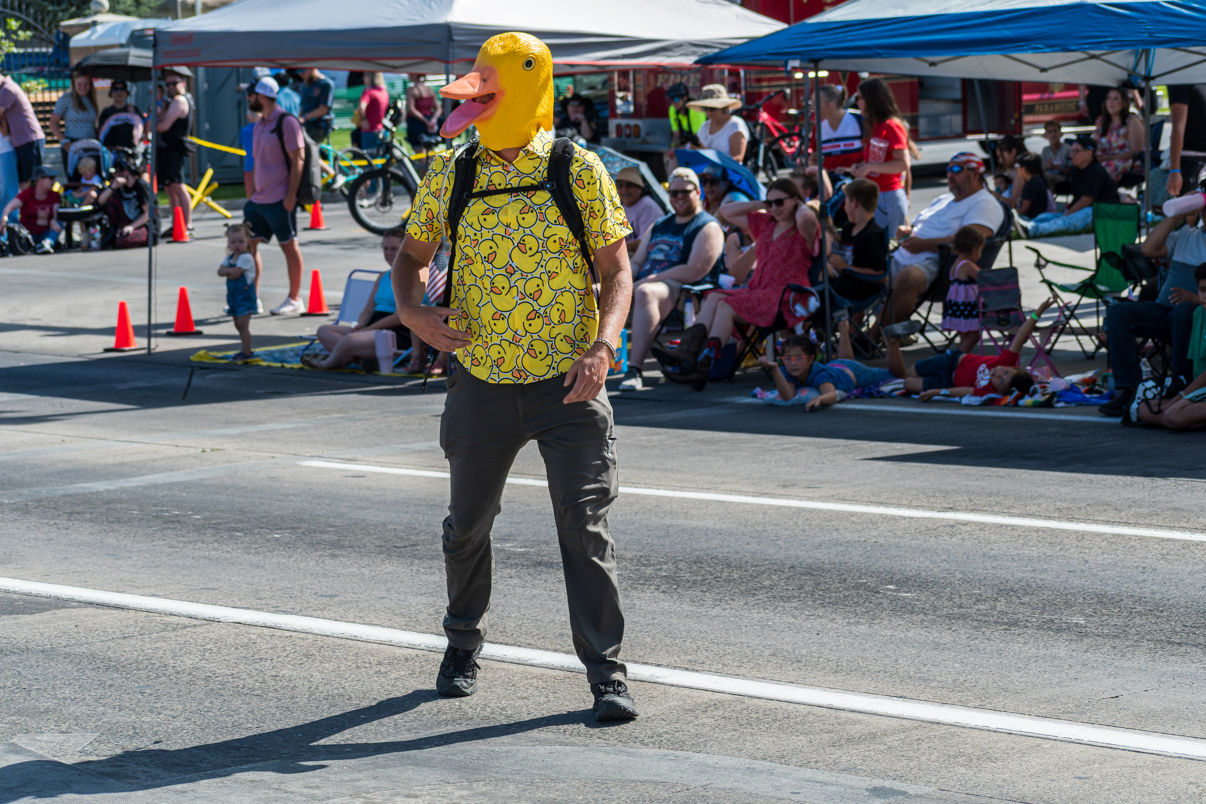 Provo, Utah – July 4, 2025: A man wearing a duck mask participates in the Freedom Festival Grand Parade in downtown Provo.