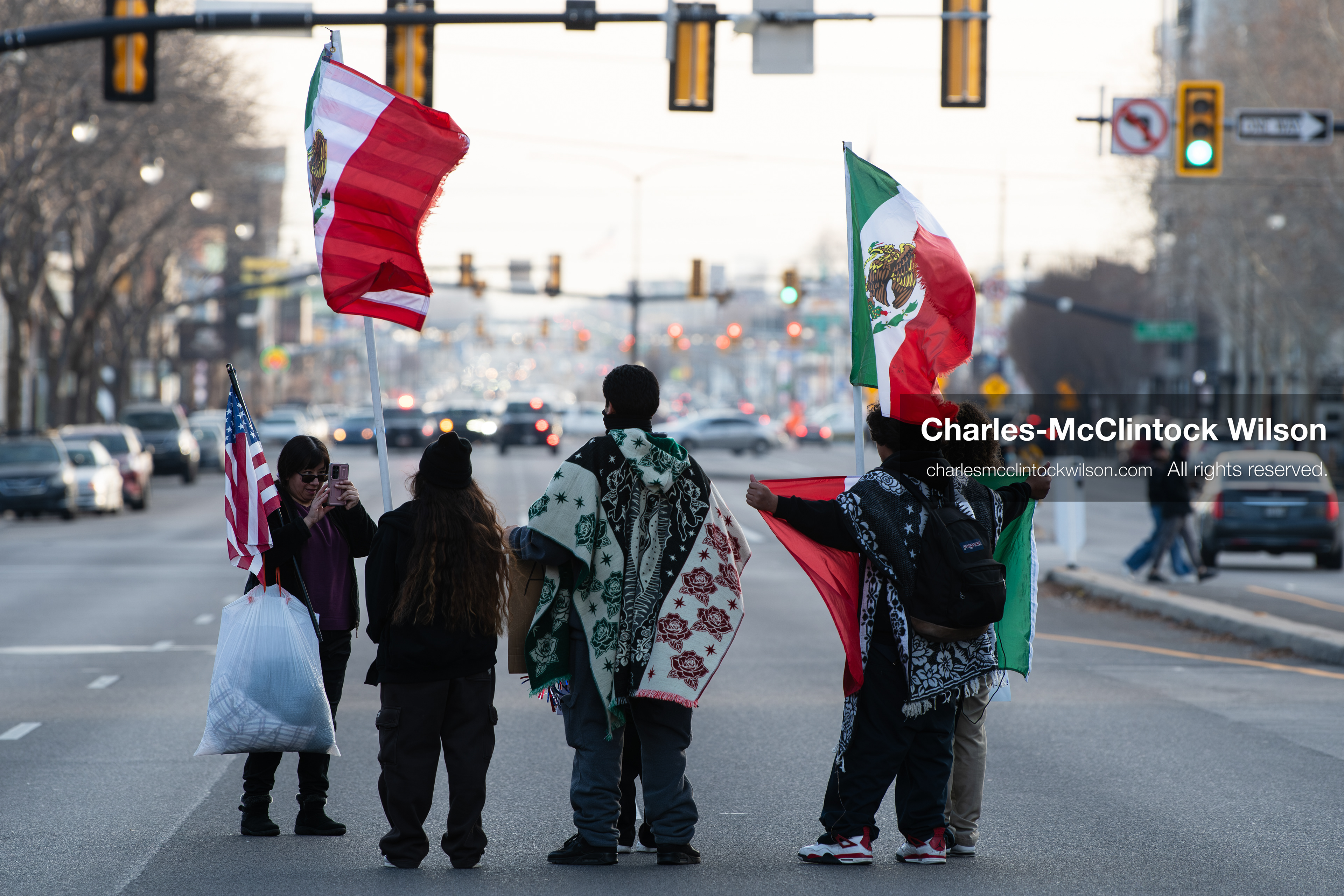 January 30, 2026, Salt Lake City, Utah, USA: Demonstrators stand in the street waving Mexican flags during an anti‑ICE protest in Salt Lake City, part of a nationwide response to immigration enforcement policies. (Credit Image: © Charles‑McClintock Wilson/ZUMA Press Wire)