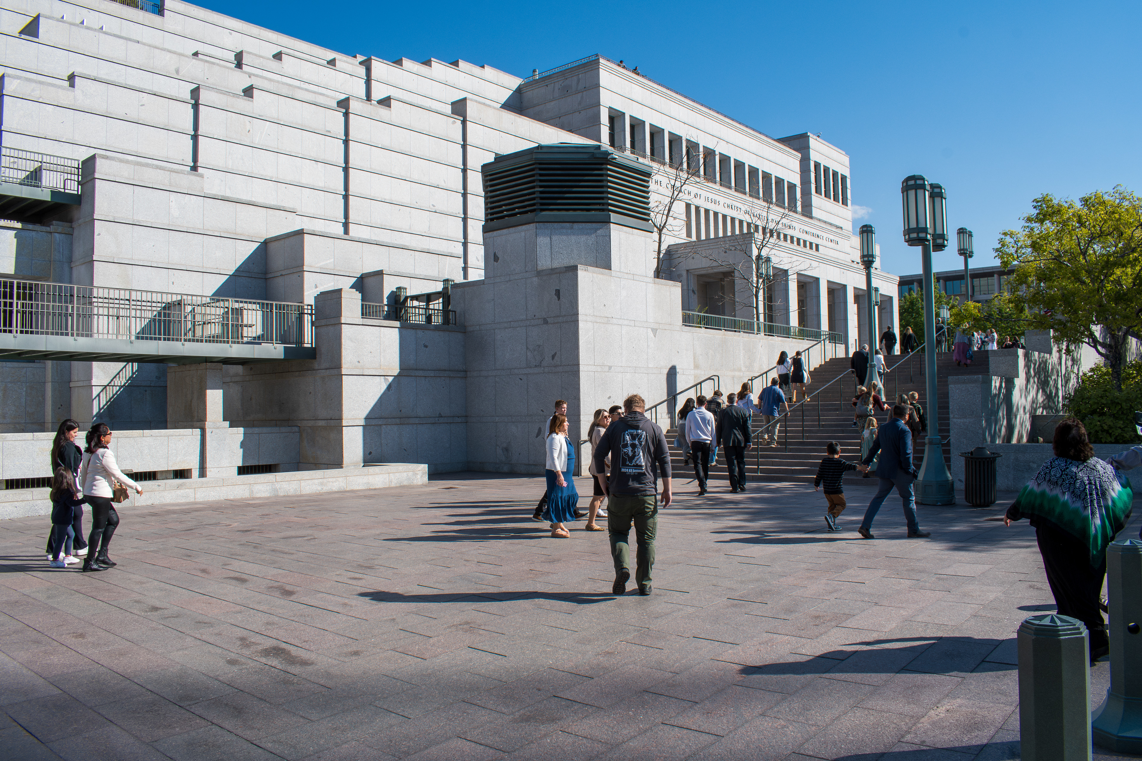 October 6, 2025, Salt Lake City, Utah, USA: People walk through the plaza outside the Conference Center during the public viewing for Russell M. Nelson, the 17th president of the Church of Jesus Christ of Latter-day Saints. Flags fly at half-mast following the death of Nelson at his home in Salt Lake City, Utah, on September 27, 2025, at the age of 101. (Credit Image: © Charles-McClintock Wilson/ZUMA Press Wire)