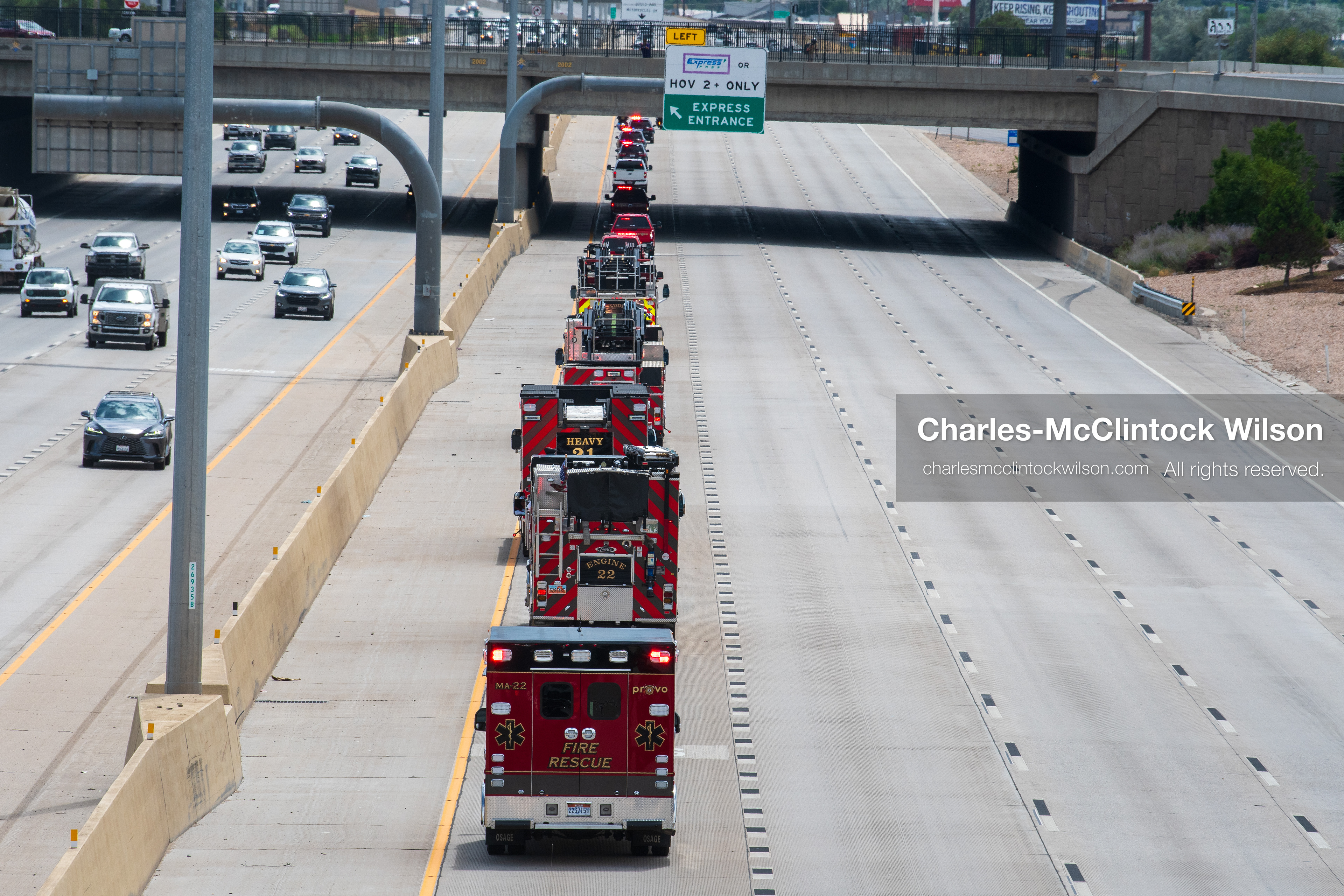A long line of fire engines and emergency response vehicles travels in a single file column along the express lane of Interstate 15 during a funeral procession for Provo Fire Captain Spencer Long and his family in Orem, Utah, on Wednesday, July 29, 2026. More than 300 people came to the public memorial ceremony to honor the five family members who died after a flash flood hit their campsite near the Sunglow Campground in Wayne County. (Photo by Charles-McClintock Wilson/Sipa USA)