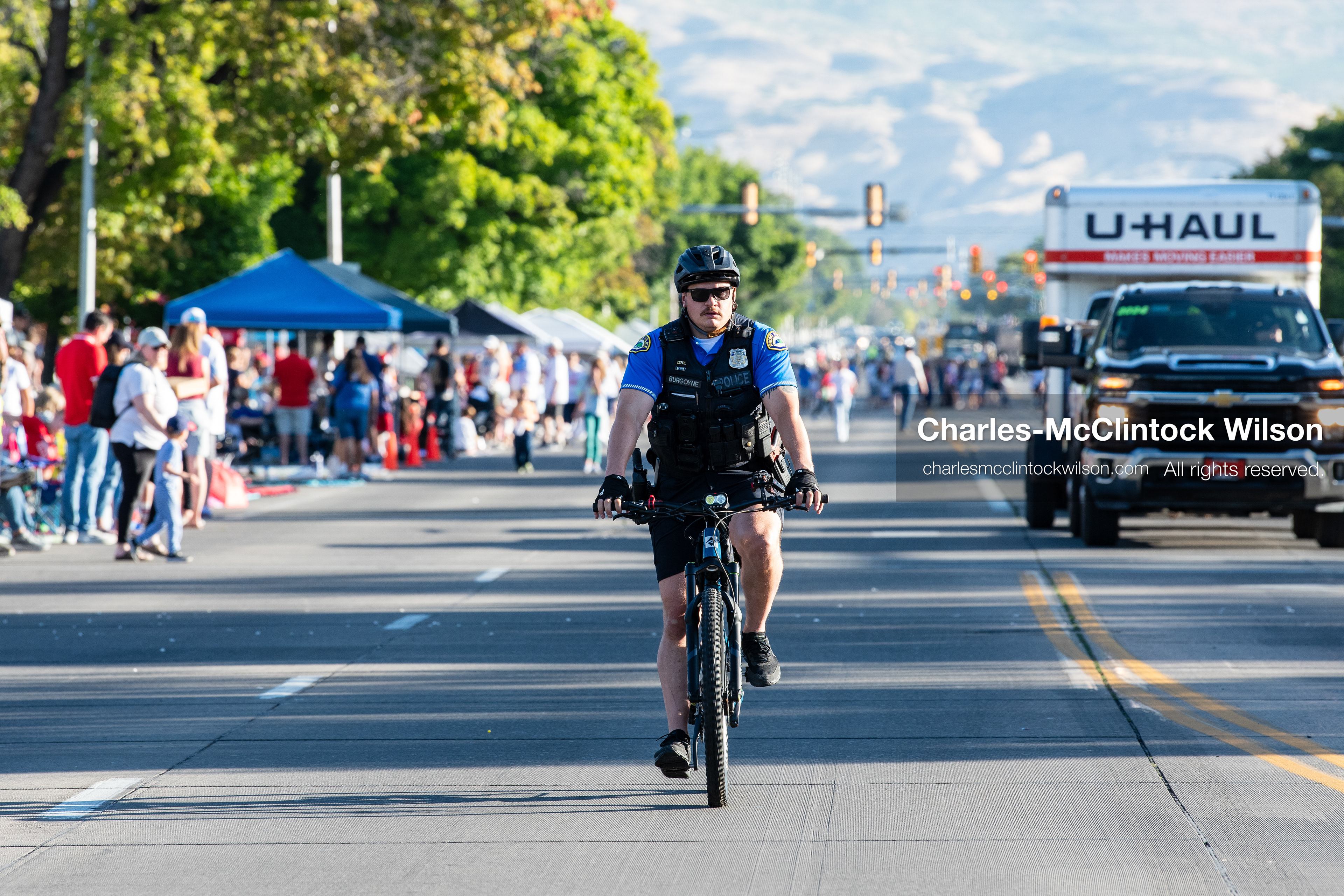 July 4, 2026, Provo, Utah, USA: A police officer on a bicycle patrols the street ahead of the procession during America's Freedom Festival Grand Parade in Provo, Utah, Saturday, July 4, 2026. The annual Independence Day event features expanded programming to honor the 250th anniversary of United States independence. (Credit Image: © Charles-McClintock Wilson/ZUMA Press Wire)