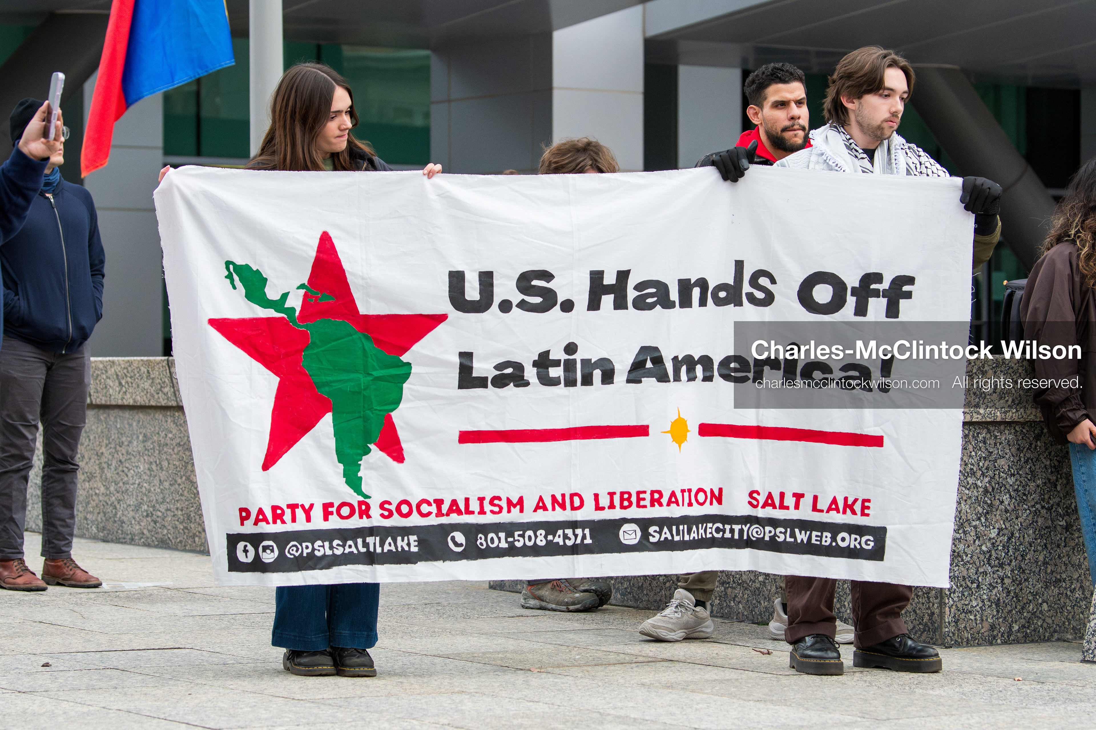January 3, 2026, Salt Lake City, Utah, USA: Protesters display a banner during a demonstration against US action in Venezuela outside the Wallace Federal Building in Salt Lake City, Utah. The protest was part of a nationwide mobilization responding to recent military developments. (Credit Image: (c) Charles‑McClintock Wilson/ZUMA Press Wire)