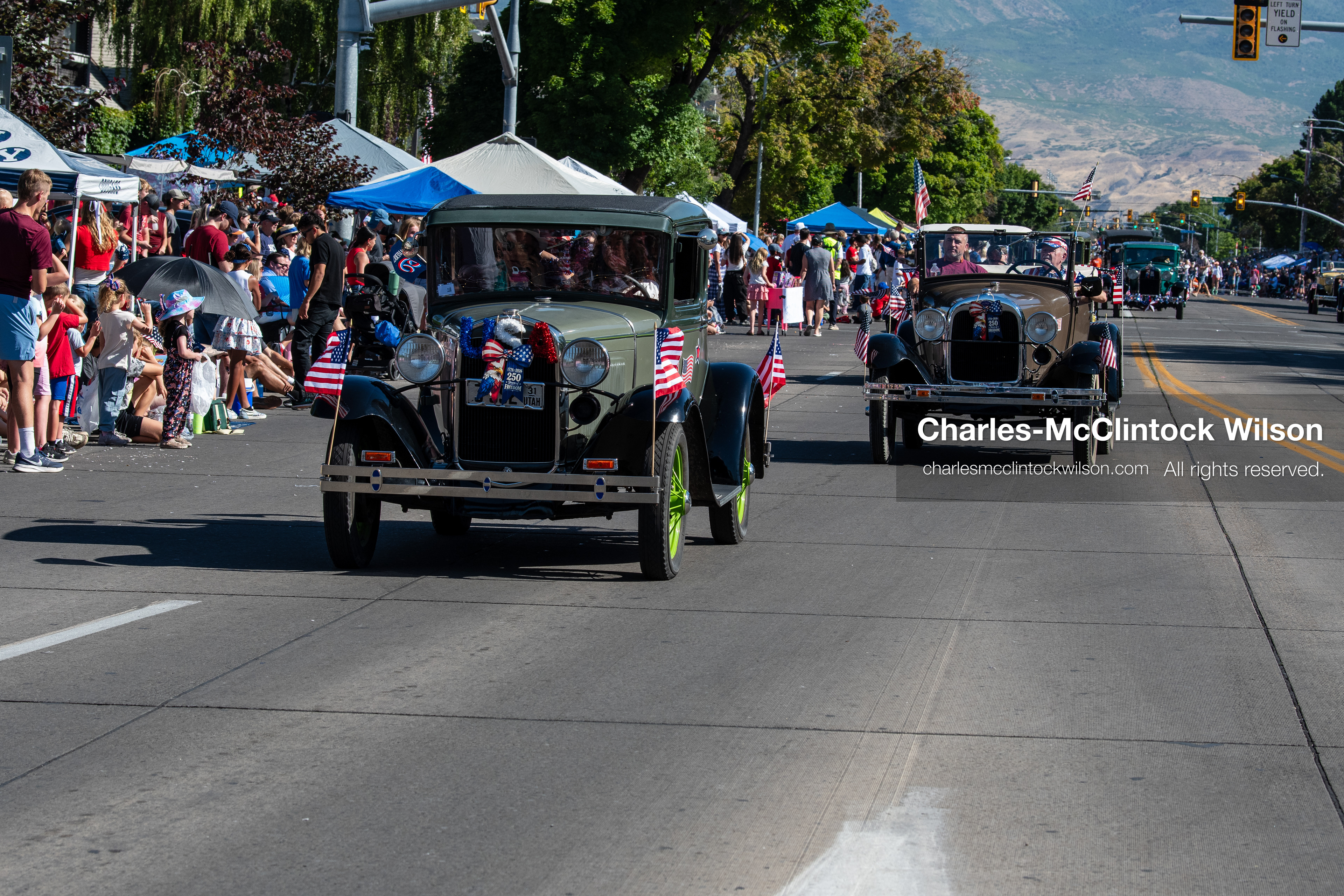 July 4, 2026, Provo, Utah, USA: Vintage classic cars drive along University Avenue past crowds lining the street during America's Freedom Festival Grand Parade in Provo, Utah, Saturday, July 4, 2026. The annual Independence Day event features expanded programming to honor the 250th anniversary of United States independence. (Credit Image: © Charles-McClintock Wilson/ZUMA Press Wire)