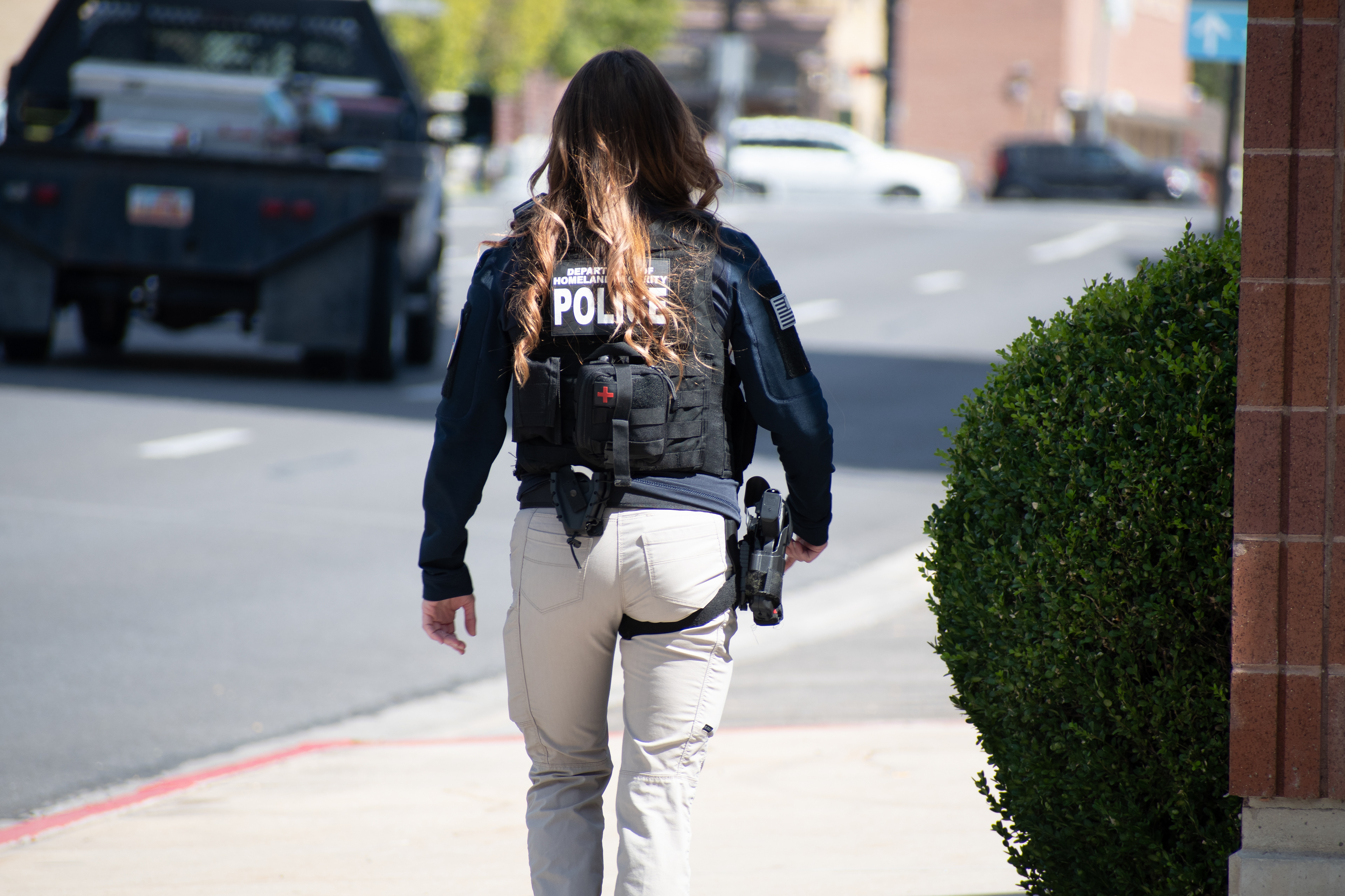 A Homeland Security police officer walks near the Utah Valley Convention Center during a Department of Homeland Security career expo focused on recruiting law enforcement and security personnel. Photograph by Charles‑McClintock Wilson / ZUMA Press Wire