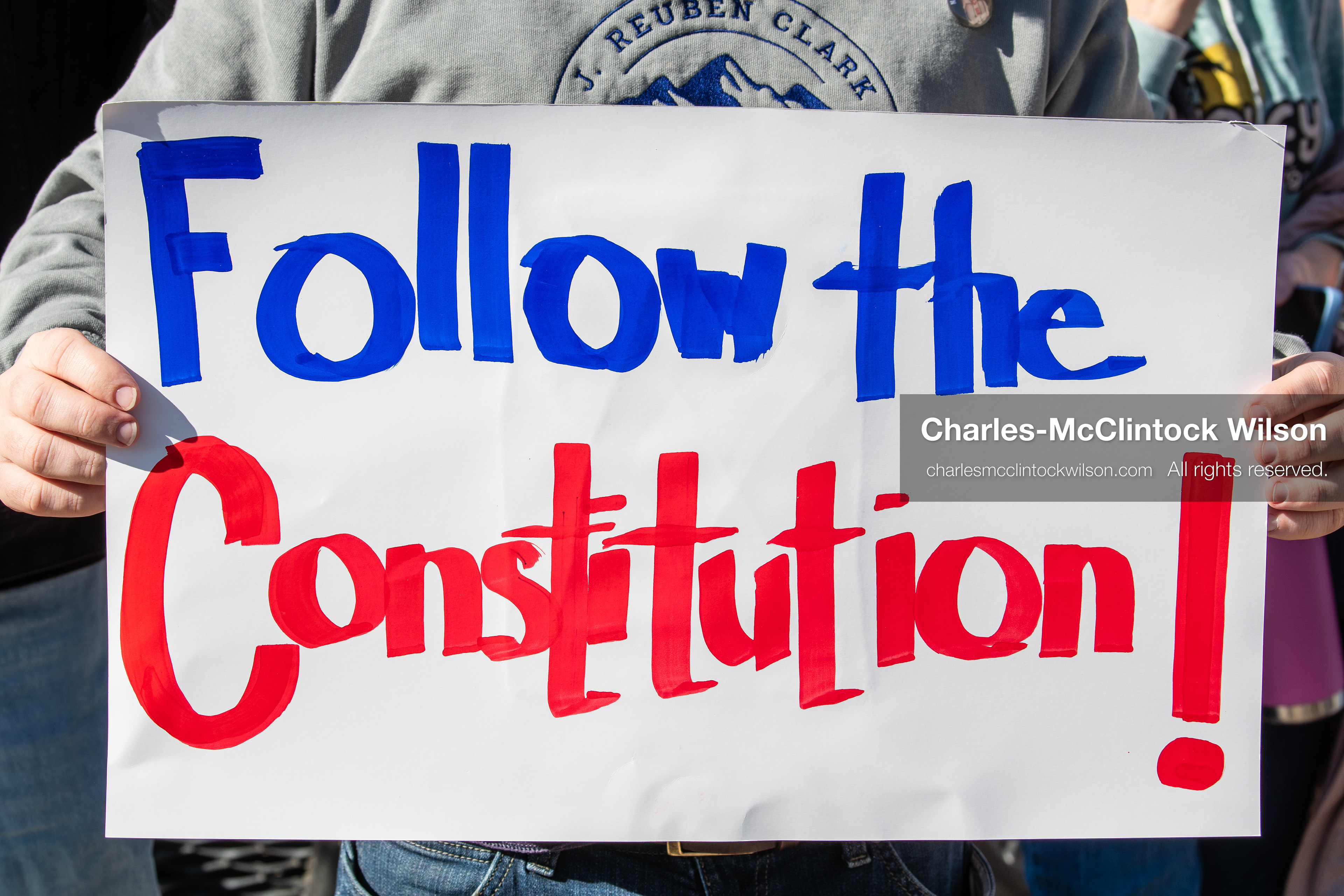 February 5, 2026, Provo, Utah, USA: A demonstrator holds a sign during a gathering near Brigham Young University in Provo where students and community members protested the presence of US Customs and Border Protection recruiters at a career fair held on the BYU campus. (Credit Image: © Charles McClintock Wilson/ZUMA Press Wire)