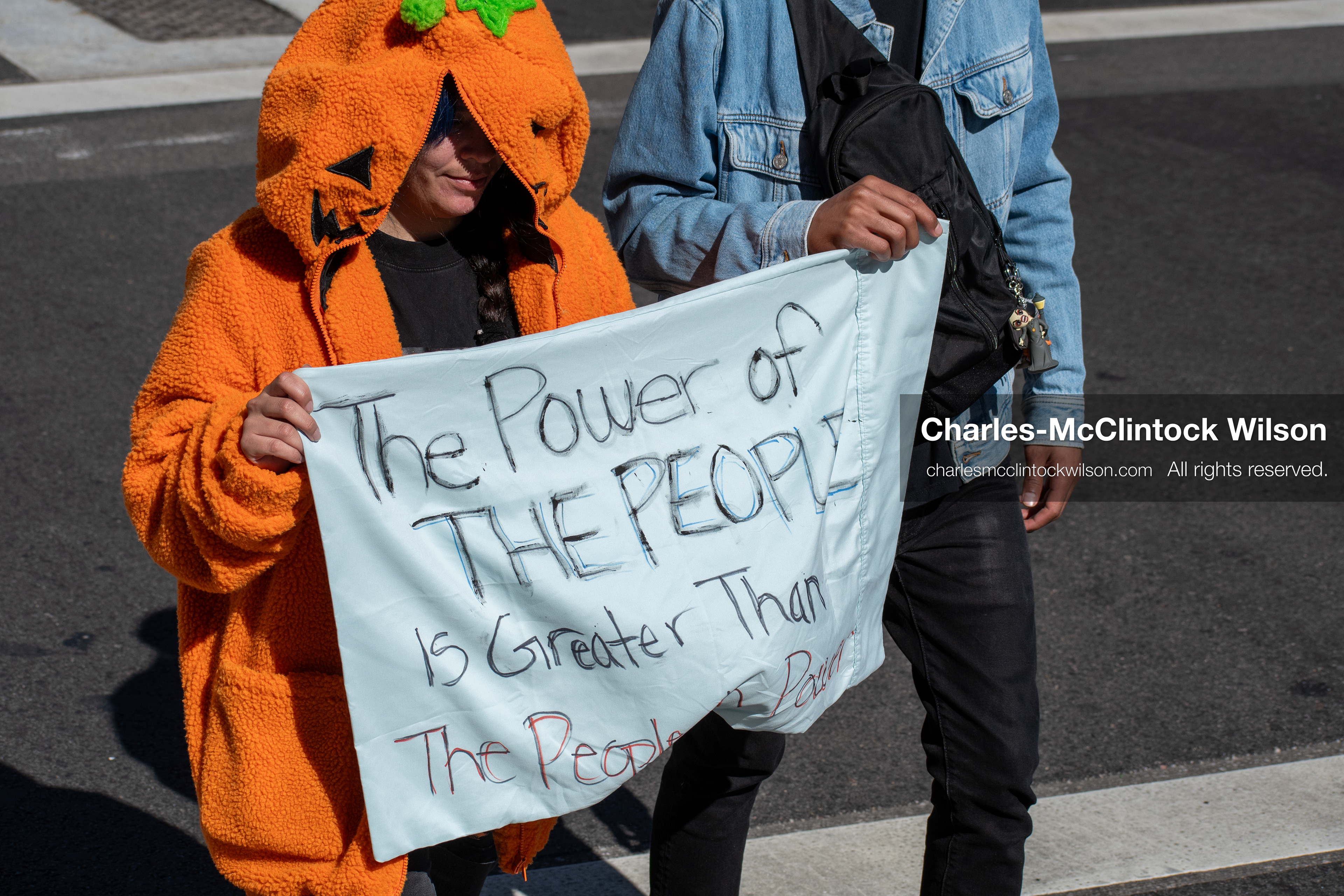 October 18, 2025, Salt Lake City, Utah, USA: Demonstrators march along South State Street during a "No Kings" protest in Salt Lake City, Utah. The protest was part of a nationwide mobilization.