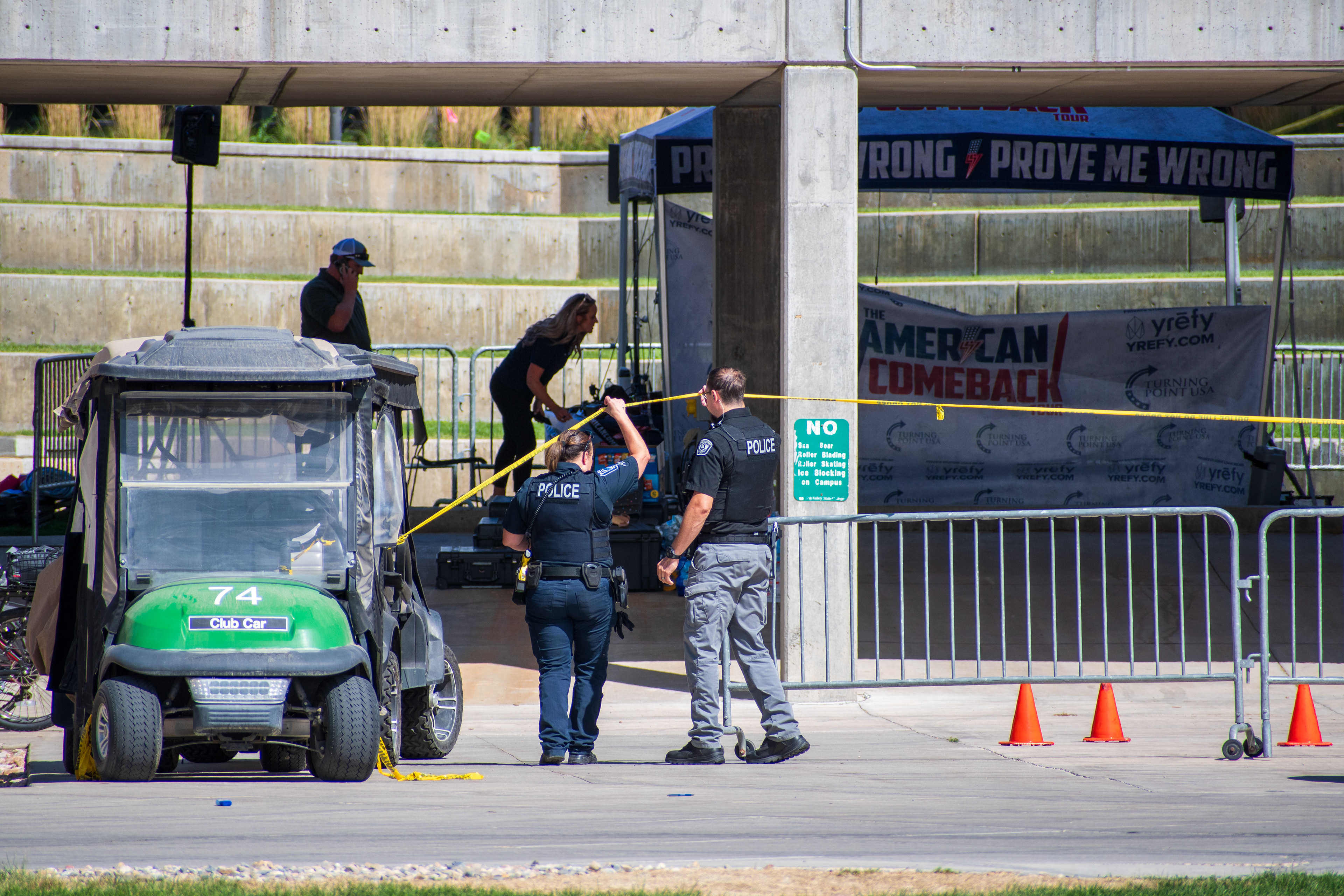 September 12, 2025 – Orem, Utah, United States: Police officers secure an area with caution tape near a tented display at Utah Valley University following the fatal shooting of conservative activist Charlie Kirk, who was assassinated during a public event on campus two days earlier. Photograph by Charles‑McClintock Wilson / ZUMA Press Wire