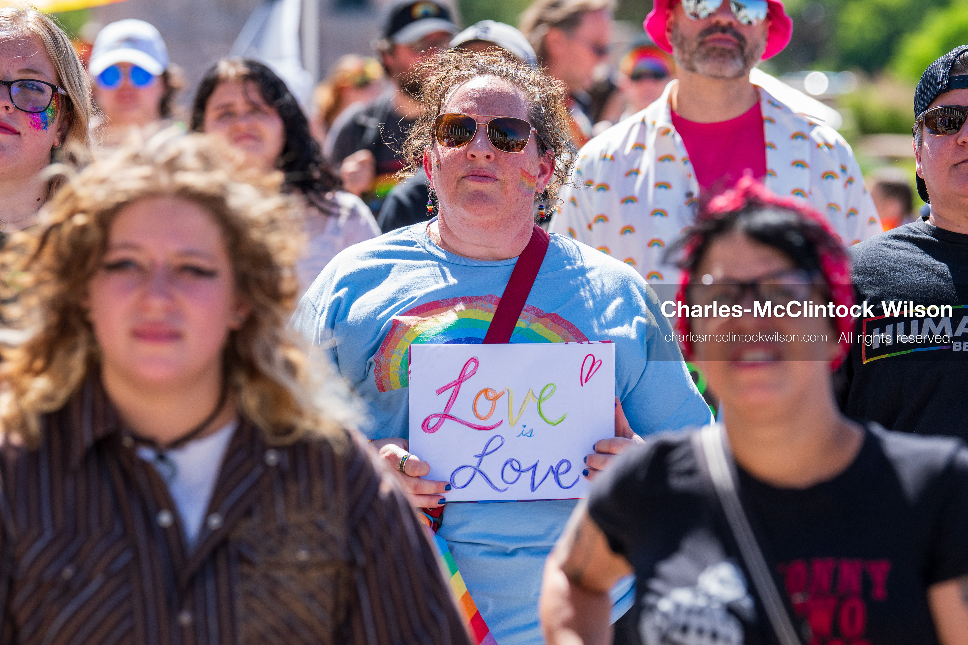 June 6, 2026, Salt Lake City, Utah, USA: A participant holds a sign reading ''Love is Love'' while walking with a crowd during the Utah Pride Rally and March. (Credit Image: © Charles McClintock Wilson/ZUMA Press Wire)