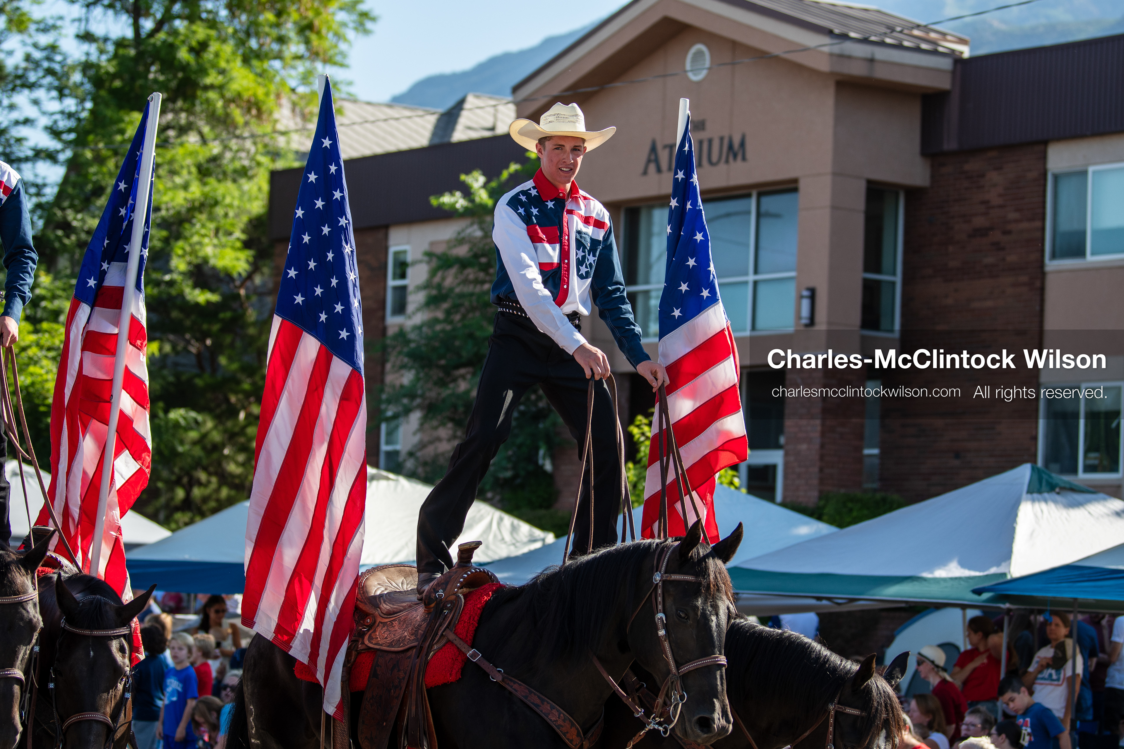  July 4, 2026, Provo, Utah, USA: Equestrian performers balance upright on horseback while carrying American flags down the street during America's Freedom Festival Grand Parade in Provo, Utah, Saturday, July 4, 2026. The annual Independence Day event features expanded programming to honor the 250th anniversary of United States independence. (Credit Image: © Charles-McClintock Wilson/ZUMA Press Wire)