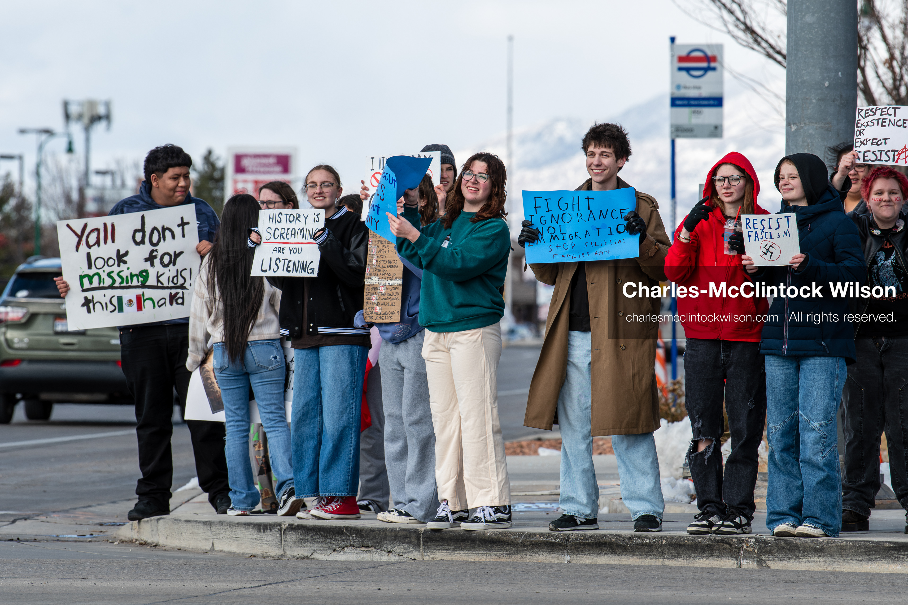 February 20, 2026, Orem, Utah, USA: High school students gather along State Street in front of Orem City Hall during a student led protest against ICE and federal immigration enforcement. Demonstrators hold signs as they stand near the roadway while traffic continues through the area. (Credit Image: © Charles McClintock Wilson/ZUMA Press Wire)