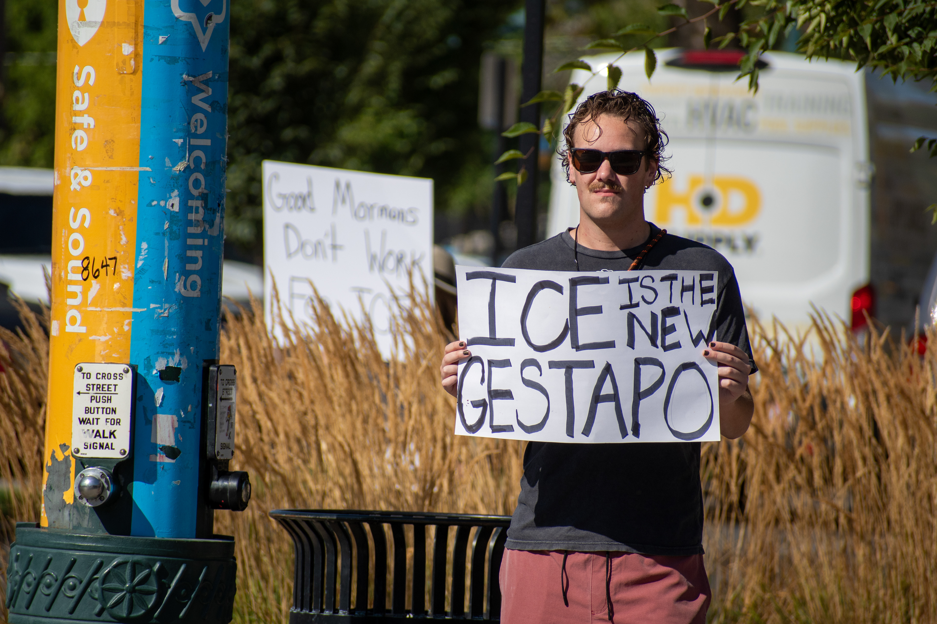 September 15, 2025 – Provo, Utah, United States: A demonstrator holds a sign reading “ICE IS THE NEW GESTAPO” outside the Utah Valley Convention Center during a protest against the Department of Homeland Security career expo. The message draws historical parallels and critiques immigration enforcement practices. Photograph by Charles‑McClintock Wilson / ZUMA Press Wire