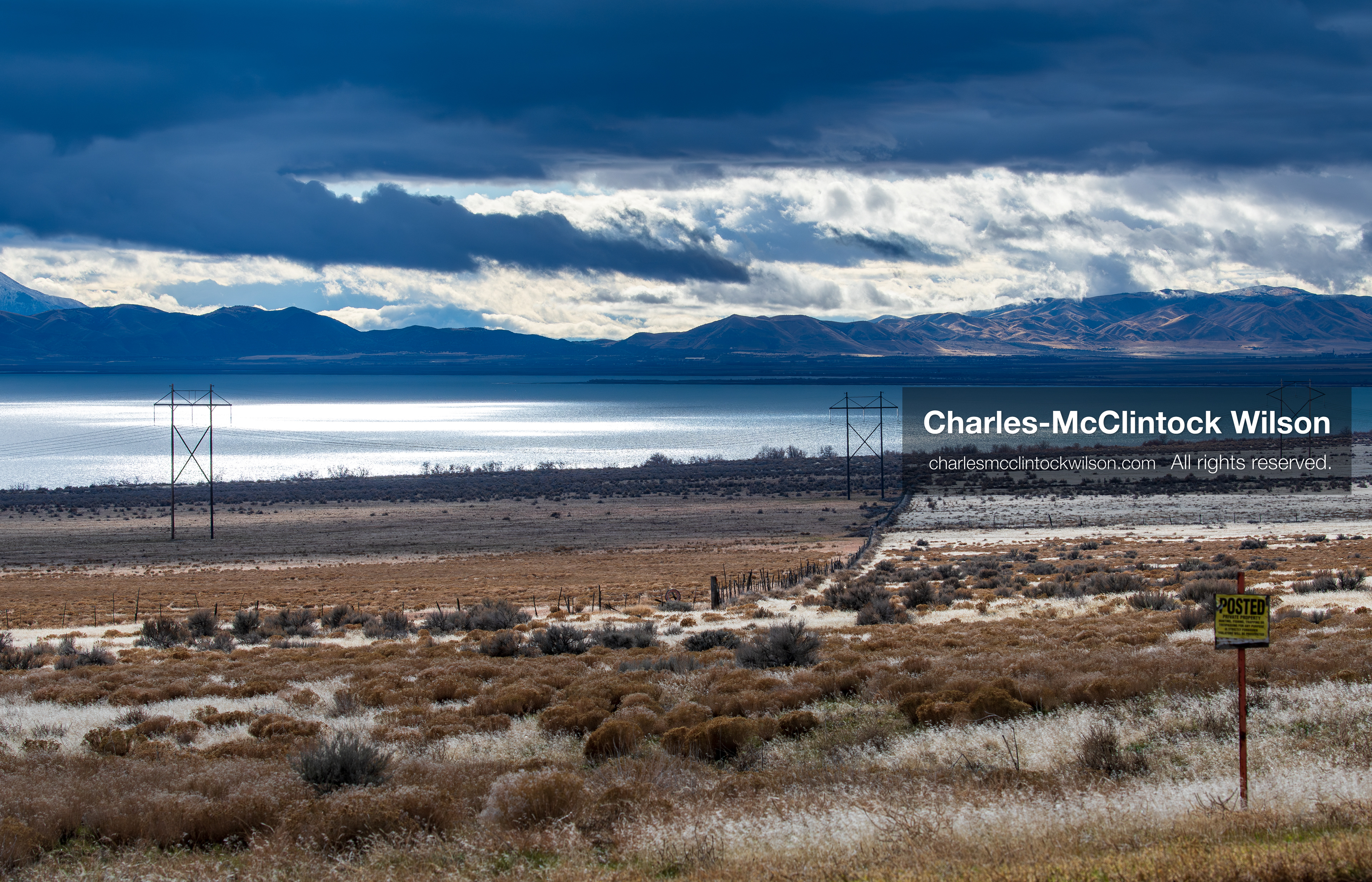 January 1, 2026, Saratoga Springs, Utah, USA: Utah Lake is seen under dramatic cloud cover on January 1, 2026, near Saratoga Springs, Utah, USA. Dry grass, power lines, and a posted sign frame the landscape as winter conditions settle across northern Utah. (Credit Image: © Charles-McClintock Wilson/ZUMA Press Wire)