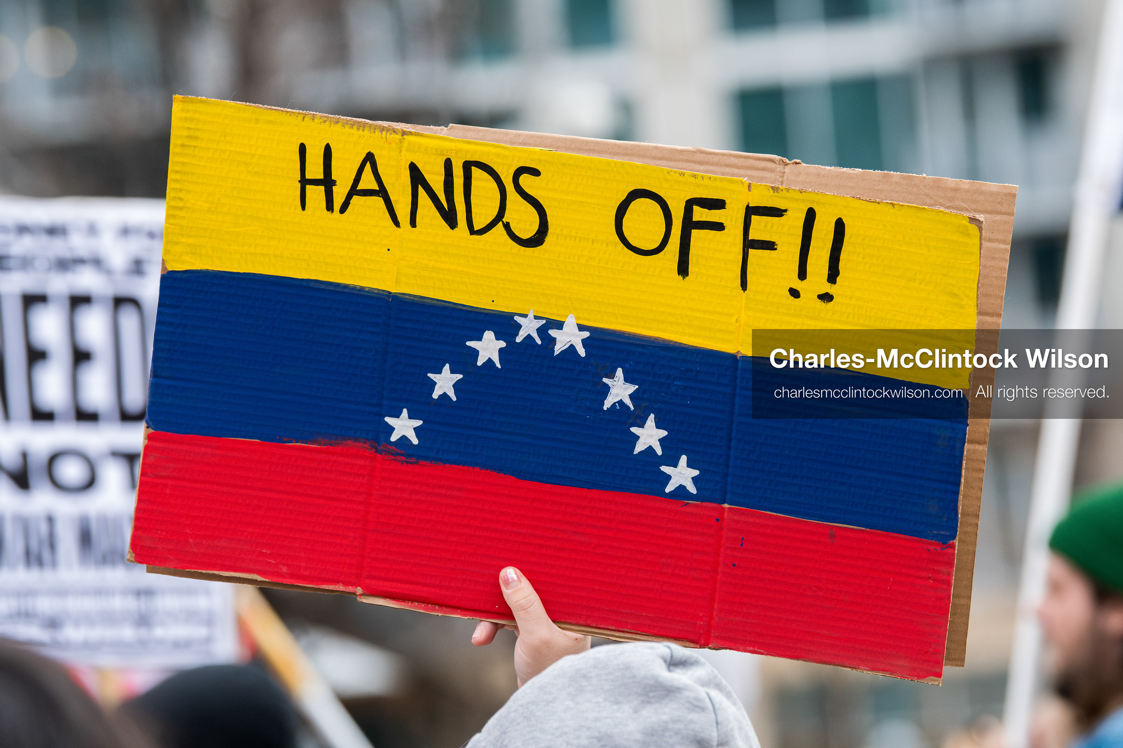 January 3, 2026, Salt Lake City, Utah, USA: A protester holds a sign during a demonstration against US action in Venezuela outside the Wallace Federal Building in Salt Lake City, Utah. The protest was part of a nationwide mobilization responding to recent military developments. (Credit Image: (c) Charles‑McClintock Wilson/ZUMA Press Wire)