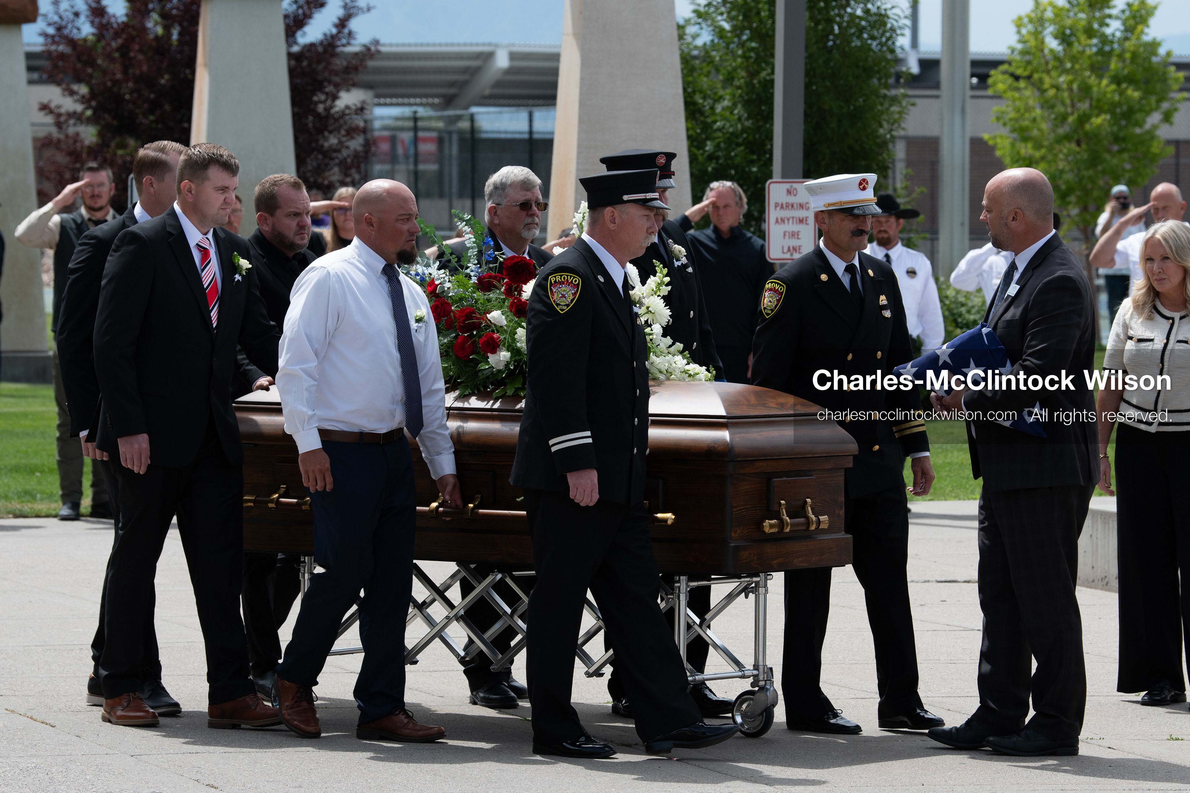 Firefighters and pallbearers escort the casket of Provo Fire Captain Spencer Long outside the UCCU Center on the campus of Utah Valley University in Orem, Utah, on Wednesday, July 29, 2026. More than 300 people came to the public memorial ceremony to honor Captain Long, his wife Katrina, and three of their sons, who died after a flash flood hit their campsite near the Sunglow Campground in Wayne County. (Photo by Charles-McClintock Wilson/Sipa USA)