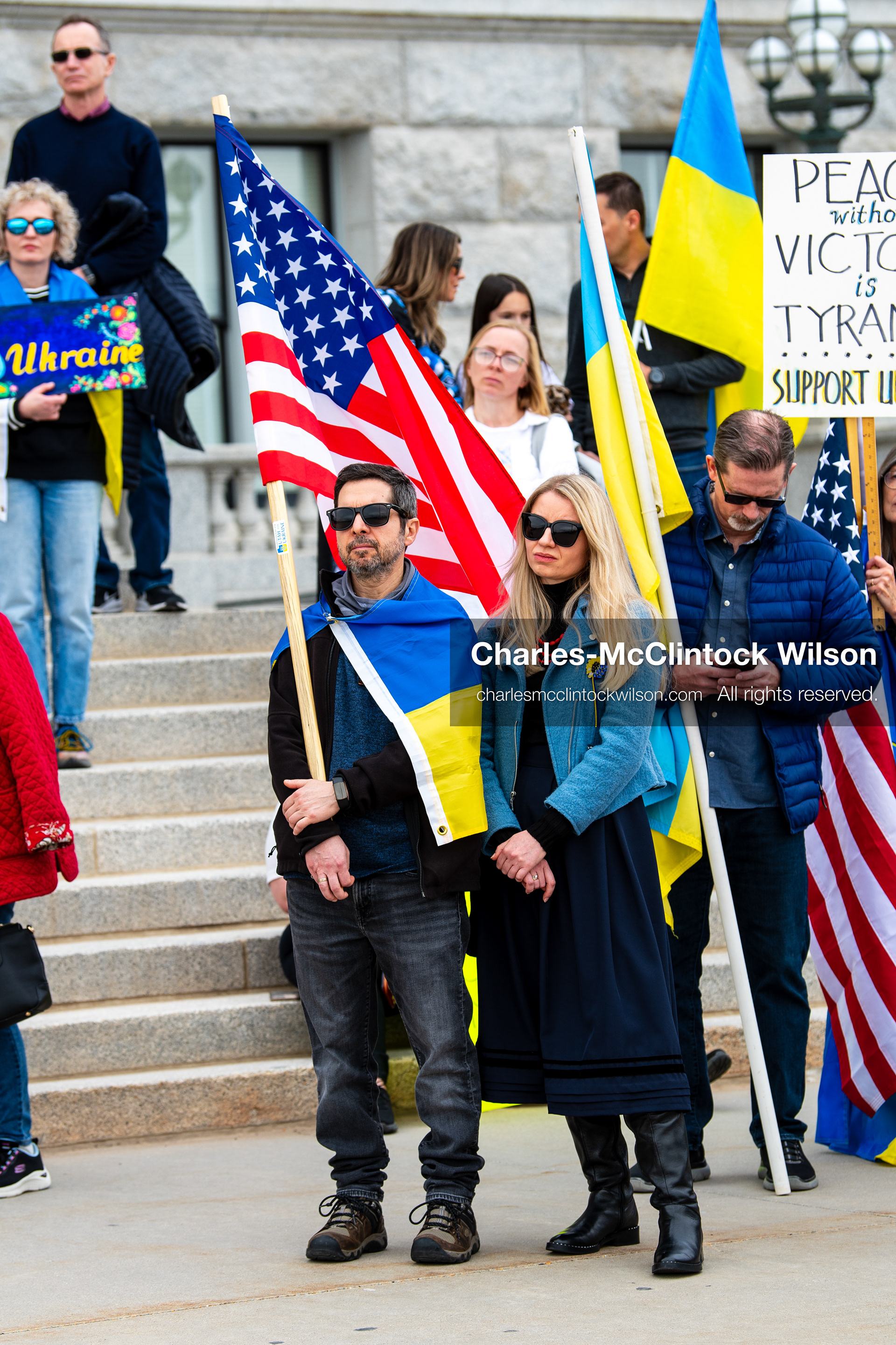 February 28, 2026, Salt Lake City, Utah, USA: Demonstrators gather on the steps near the Utah State Capitol during the Stand With Ukraine rally, holding American and Ukrainian flags along with a sign reading Peace With Honor Equals Victory vs Tyranny Support Ukraine. The gathering marked the four year anniversary of the full scale Russian invasion of Ukraine and brought community members together in support of Ukrainians and local humanitarian efforts. (Credit Image: © Charles McClintock Wilson/ZUMA Press Wire)
