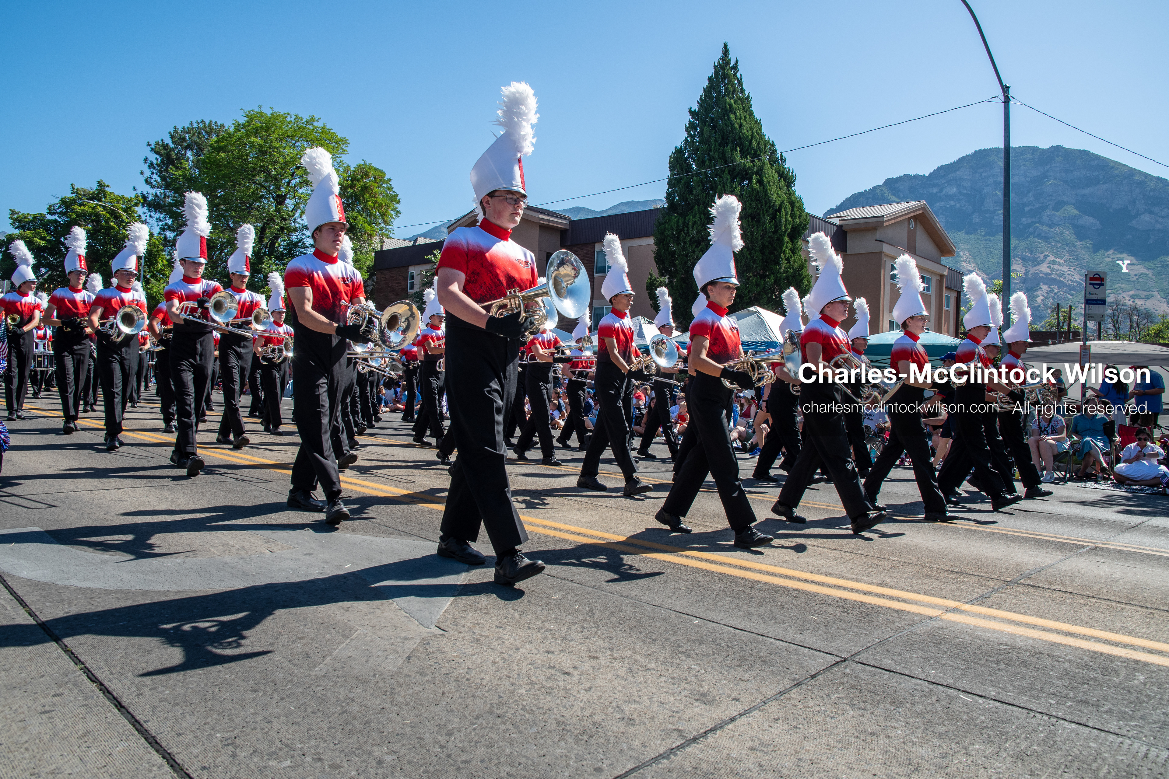 July 4, 2026, Provo, Utah, USA: Members of a high school marching band dressed in maroon and black uniforms play brass instruments while marching down the street during America's Freedom Festival Grand Parade in Provo, Utah, Saturday, July 4, 2026. The annual Independence Day event features expanded programming to honor the 250th anniversary of United States independence. (Credit Image: © Charles-McClintock Wilson/ZUMA Press Wire)