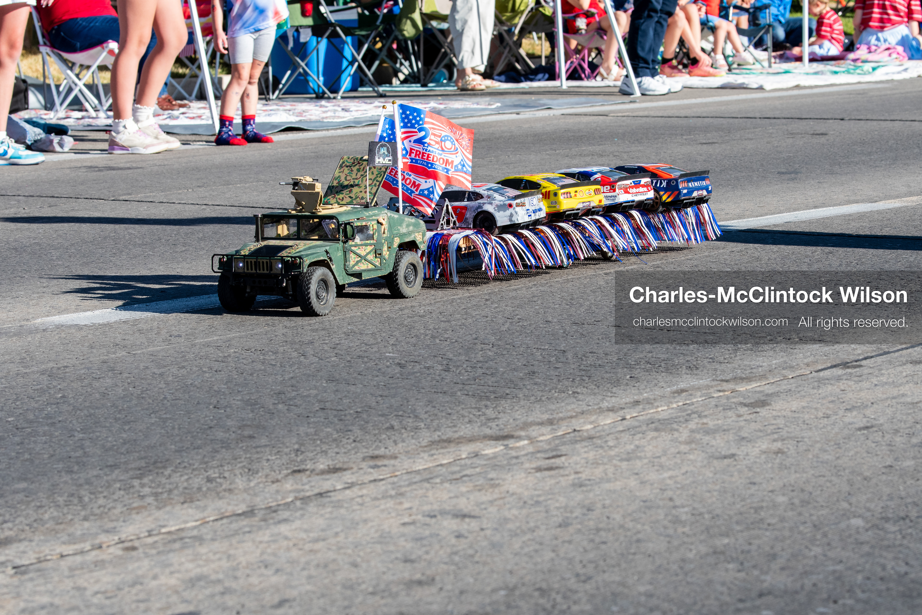 July 4, 2026, Provo, Utah, USA: A remote-controlled pickup truck decorated with small American flags tows a trailer carrying a second RC vehicle down the street during America's Freedom Festival Grand Parade in Provo, Utah, Saturday, July 4, 2026. The annual Independence Day event features expanded programming to honor the 250th anniversary of United States independence. (Credit Image: © Charles-McClintock Wilson/ZUMA Press Wire)
