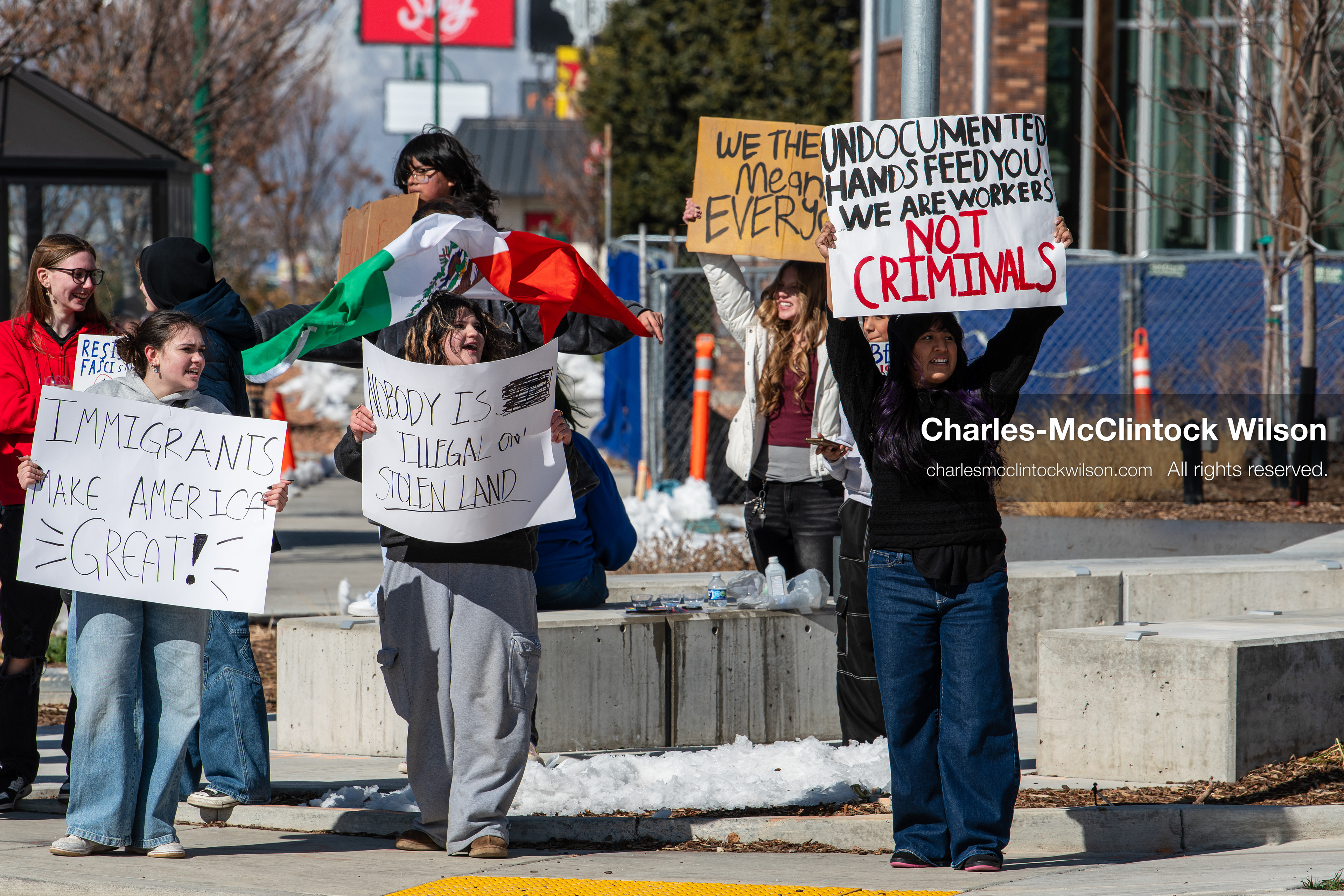 February 20, 2026, Orem, Utah, USA: High school students gather along State Street in front of Orem City Hall during a student led protest against ICE and federal immigration enforcement. Demonstrators hold signs as they stand near the roadway while traffic continues through the area. (Credit Image: © Charles McClintock Wilson/ZUMA Press Wire)