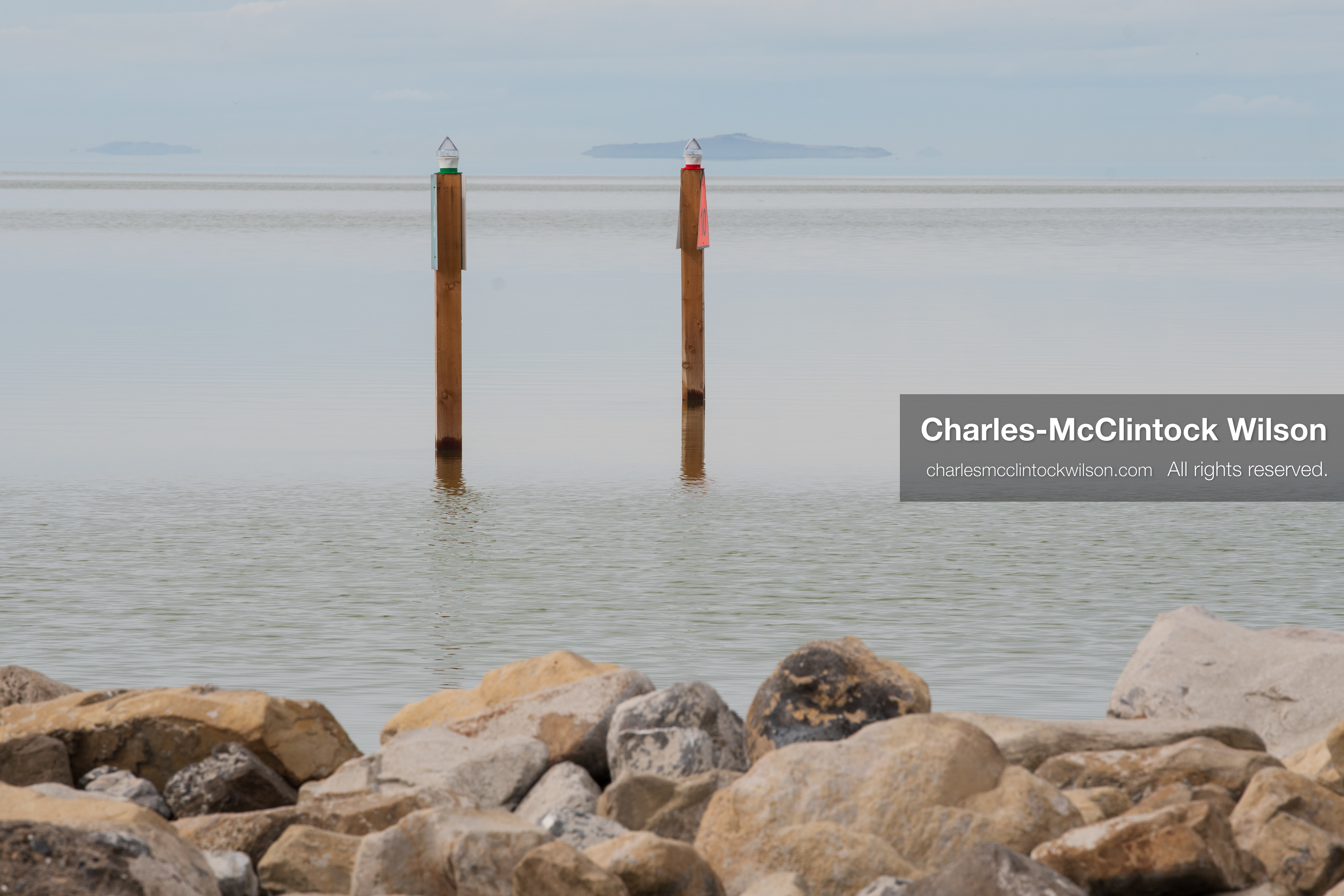 March 1, 2026, Great Salt Lake, Utah, USA: Navigation markers stand in calm water at the Great Salt Lake as the region continues to experience historically low water levels. Reports from state officials and the Great Salt Lake Strike Team state that the lake remains in a serious adverse‑effects range, with elevations among the lowest recorded in more than one hundred years. The lake has drawn increased public attention as lawmakers consider large‑scale water projects and long‑term plans to address declining conditions. (Credit Image: © Charles‑McClintock Wilson/ZUMA Press Wire)