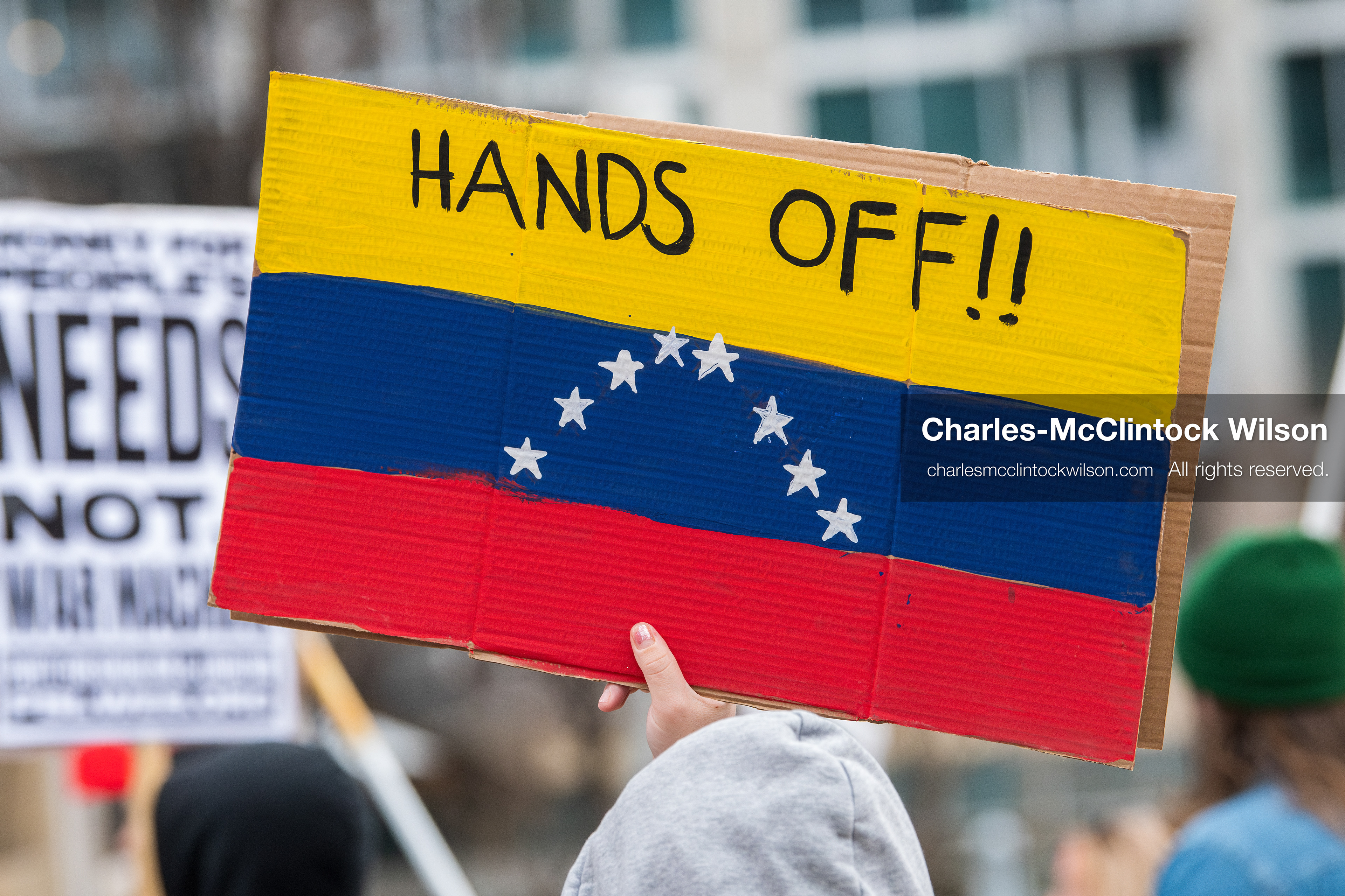 January 3, 2026, Salt Lake City, Utah, USA: A protester holds a sign during a demonstration against US action in Venezuela outside the Wallace Federal Building in Salt Lake City, Utah. The protest was part of a nationwide mobilization responding to recent military developments. (Credit Image: (c) Charles‑McClintock Wilson/ZUMA Press Wire)