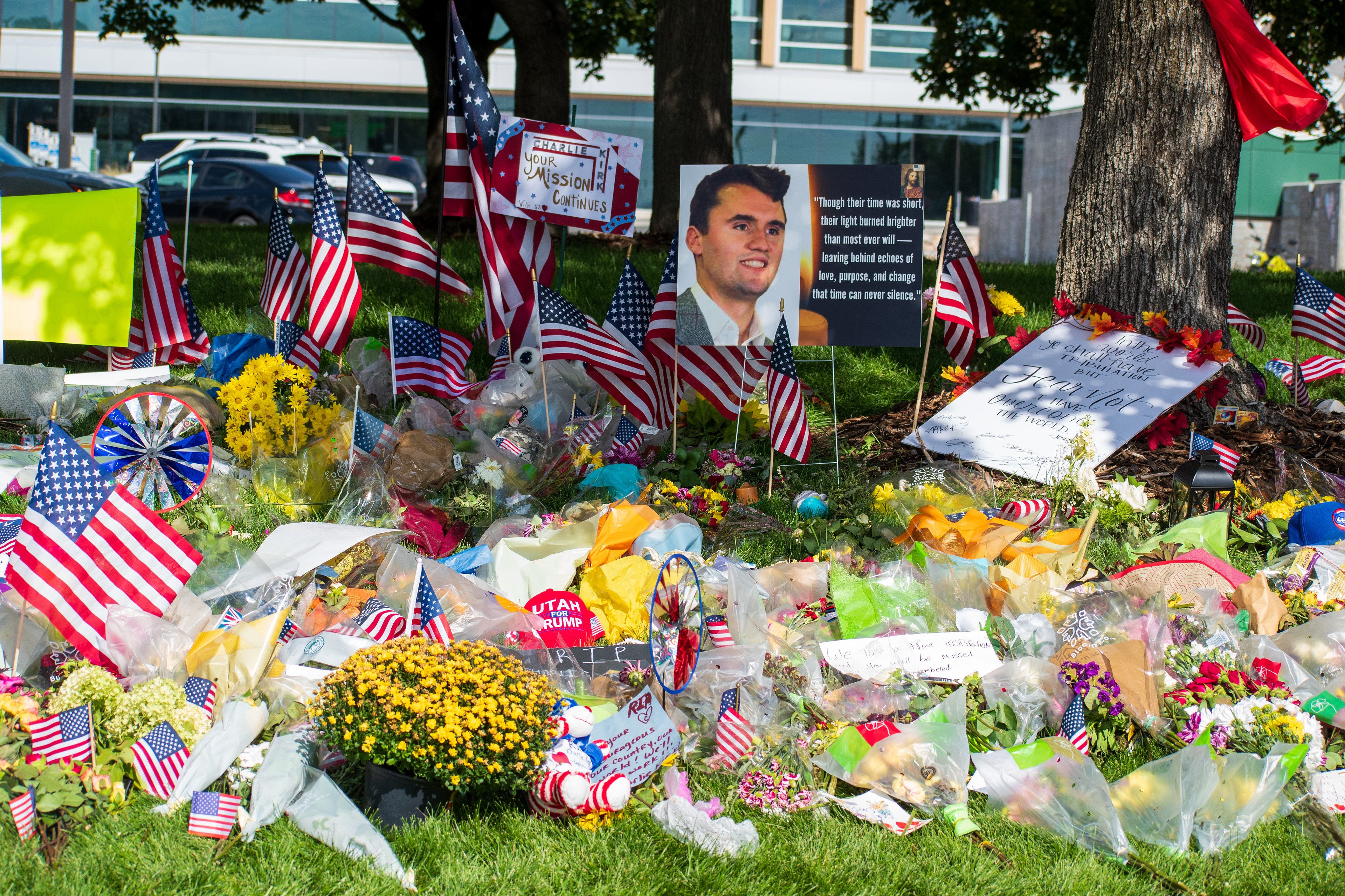OREM, UTAH – SEPTEMBER 15, 2025: A memorial honoring Charlie Kirk is seen on the campus of Utah Valley University, featuring American flags, candles, flowers, and handwritten signs arranged around a large portrait. The tribute appeared days after Kirk’s final public event at the university. © Charles‑McClintock Wilson / ZUMA Press