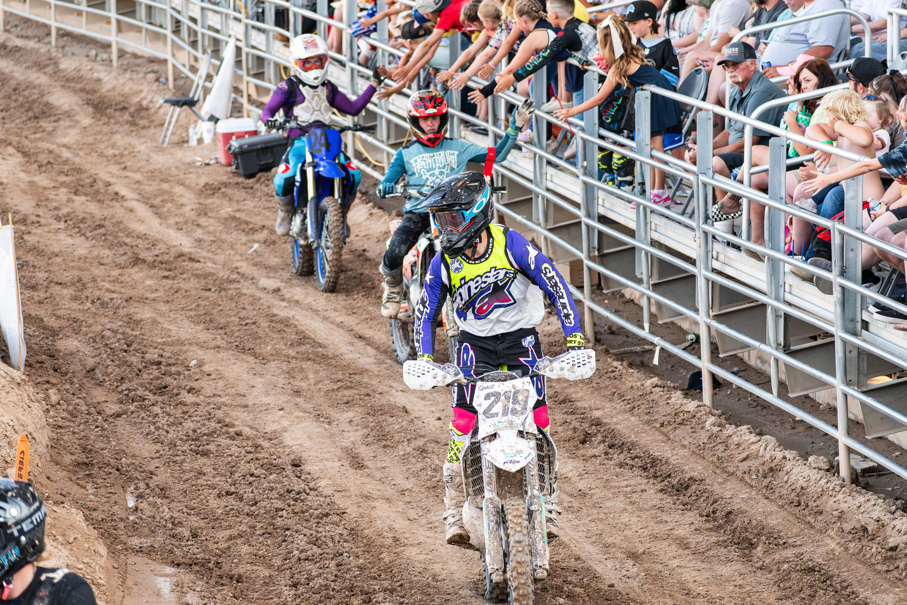Nephi, Utah – June 28, 2025: Motocross riders greet fans while exiting the arena after competing in the Juab Xtreme Racing event in Nephi, Utah.