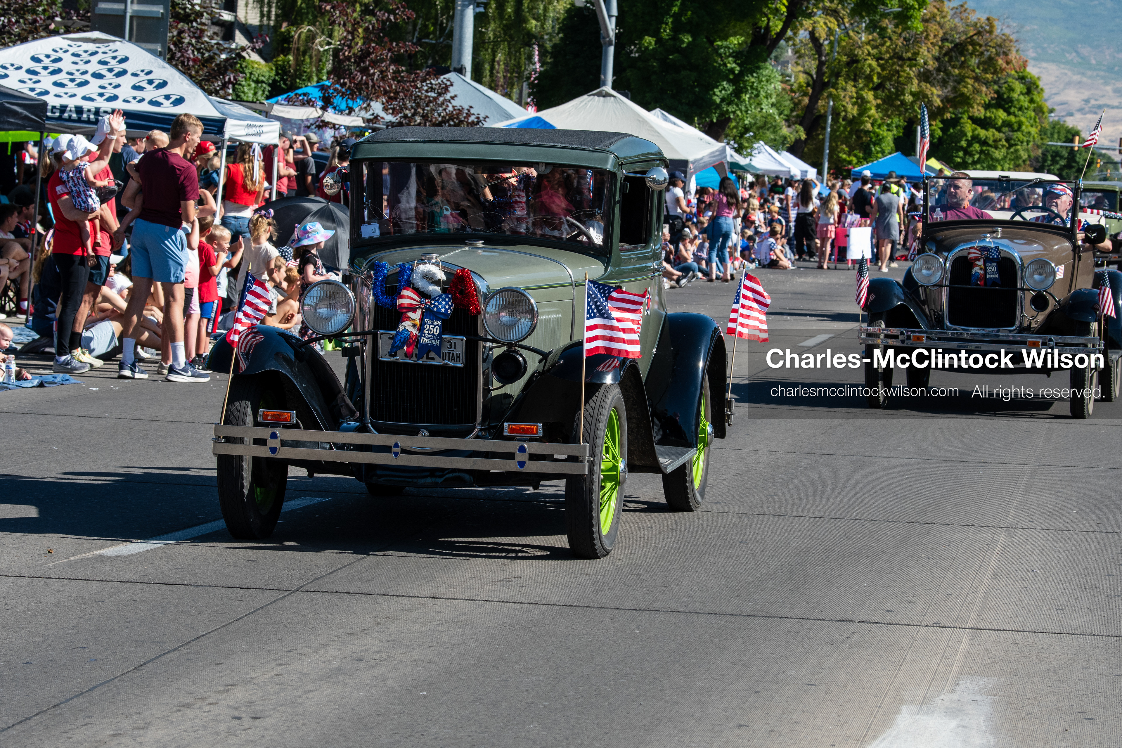July 4, 2026, Provo, Utah, USA: Vintage classic cars drive along University Avenue past crowds lining the street during America's Freedom Festival Grand Parade in Provo, Utah, Saturday, July 4, 2026. The annual Independence Day event features expanded programming to honor the 250th anniversary of United States independence. (Credit Image: © Charles-McClintock Wilson/ZUMA Press Wire)