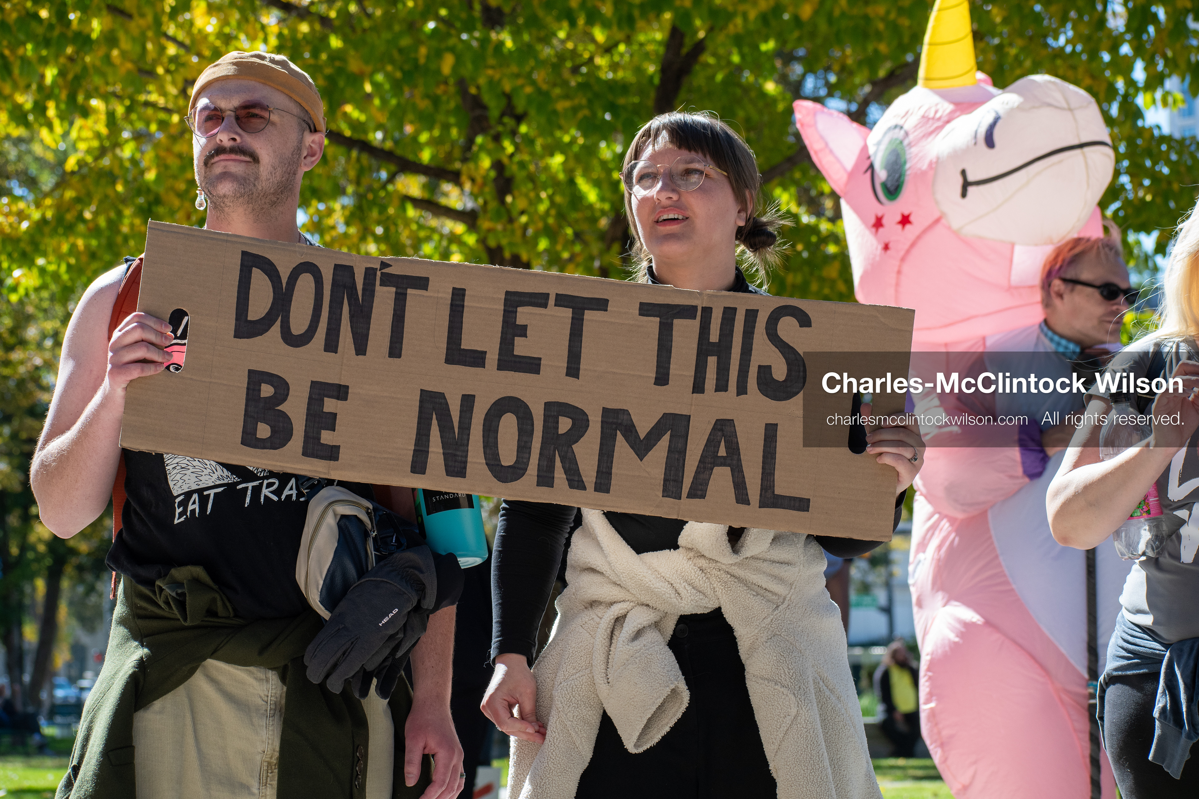 October 18, 2025, Salt Lake City, Utah, USA: Demonstrators hold a handmade sign during a "No Kings" rally at Washington Square Park in Salt Lake City, Utah. The protest was part of a nationwide mobilization.
