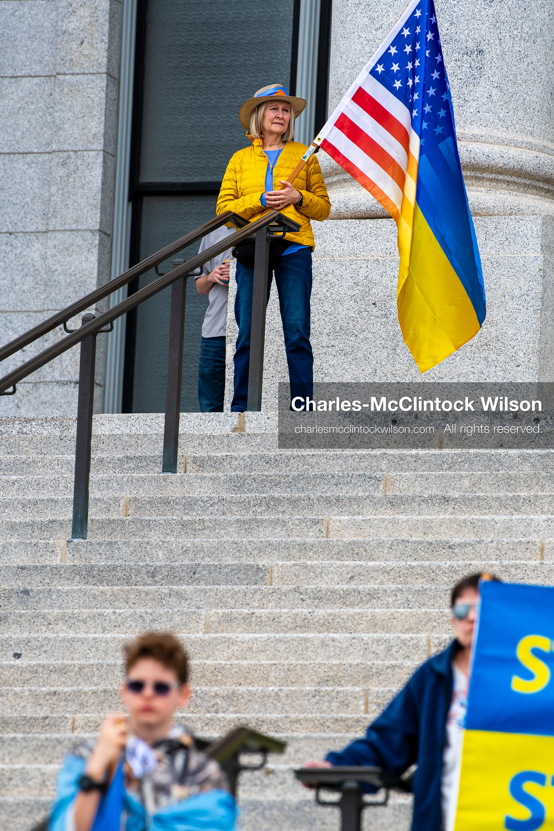 February 28, 2026, Salt Lake City, Utah, USA: Demonstrators gather on the steps near the Utah State Capitol during the Stand With Ukraine rally, holding American and Ukrainian flags along with a sign reading Peace With Honor Equals Victory vs Tyranny Support Ukraine. The gathering marked the four year anniversary of the full scale Russian invasion of Ukraine and brought community members together in support of Ukrainians and local humanitarian efforts. (Credit Image: © Charles McClintock Wilson/ZUMA Press Wire)