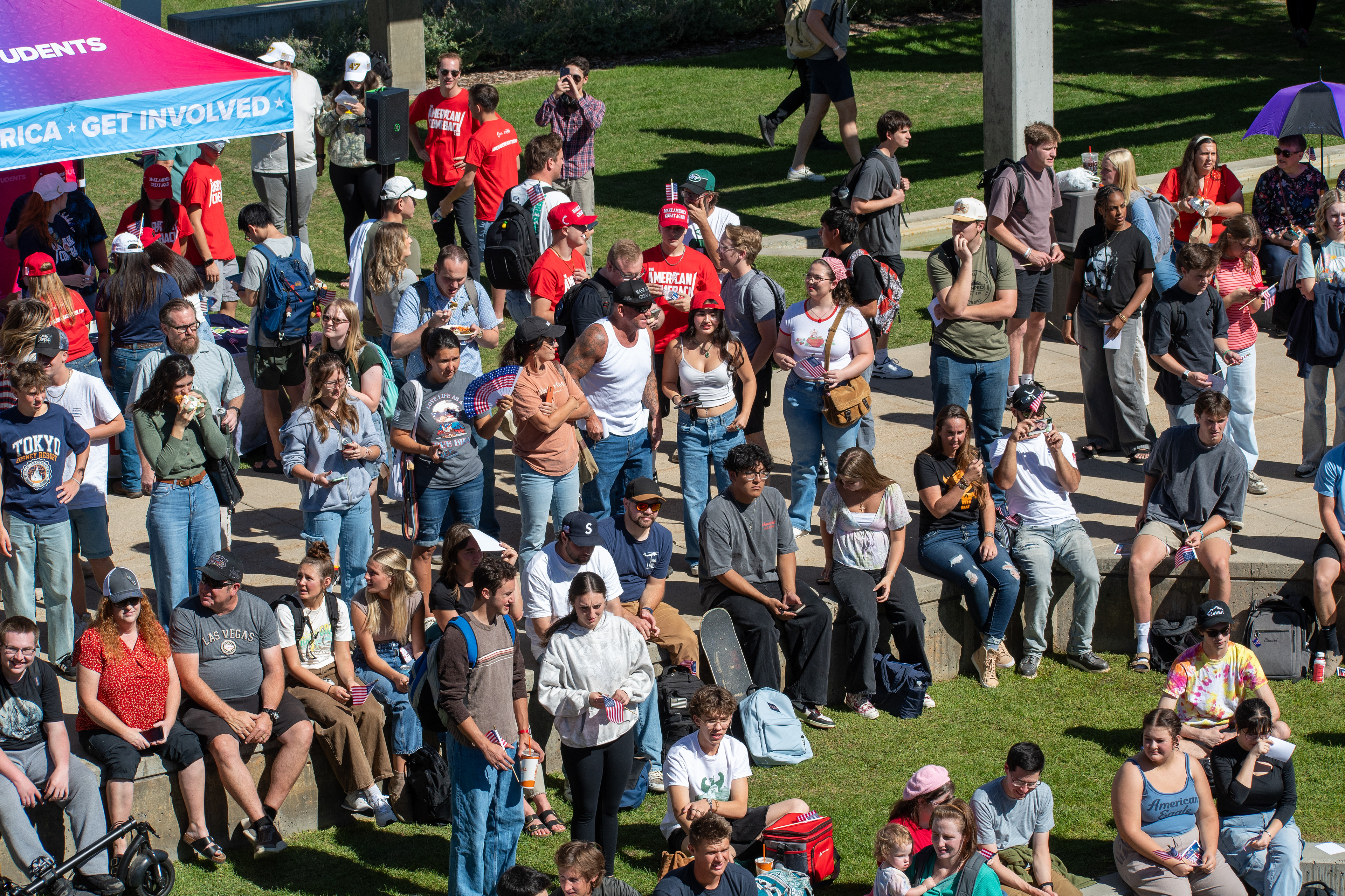 OREM, UTAH – SEPTEMBER 10, 2025: Attendees gather across the lawn and walkways at Utah Valley University during the opening stop of the American Comeback Tour. Seated and standing in casual formation, the crowd reflects a moment of civic presence, curiosity, and communal engagement. The image captures the spatial texture and emotional tone of a public event designed to connect, energize, and engage. © Charles-McClintock Wilson / ZUMA Press