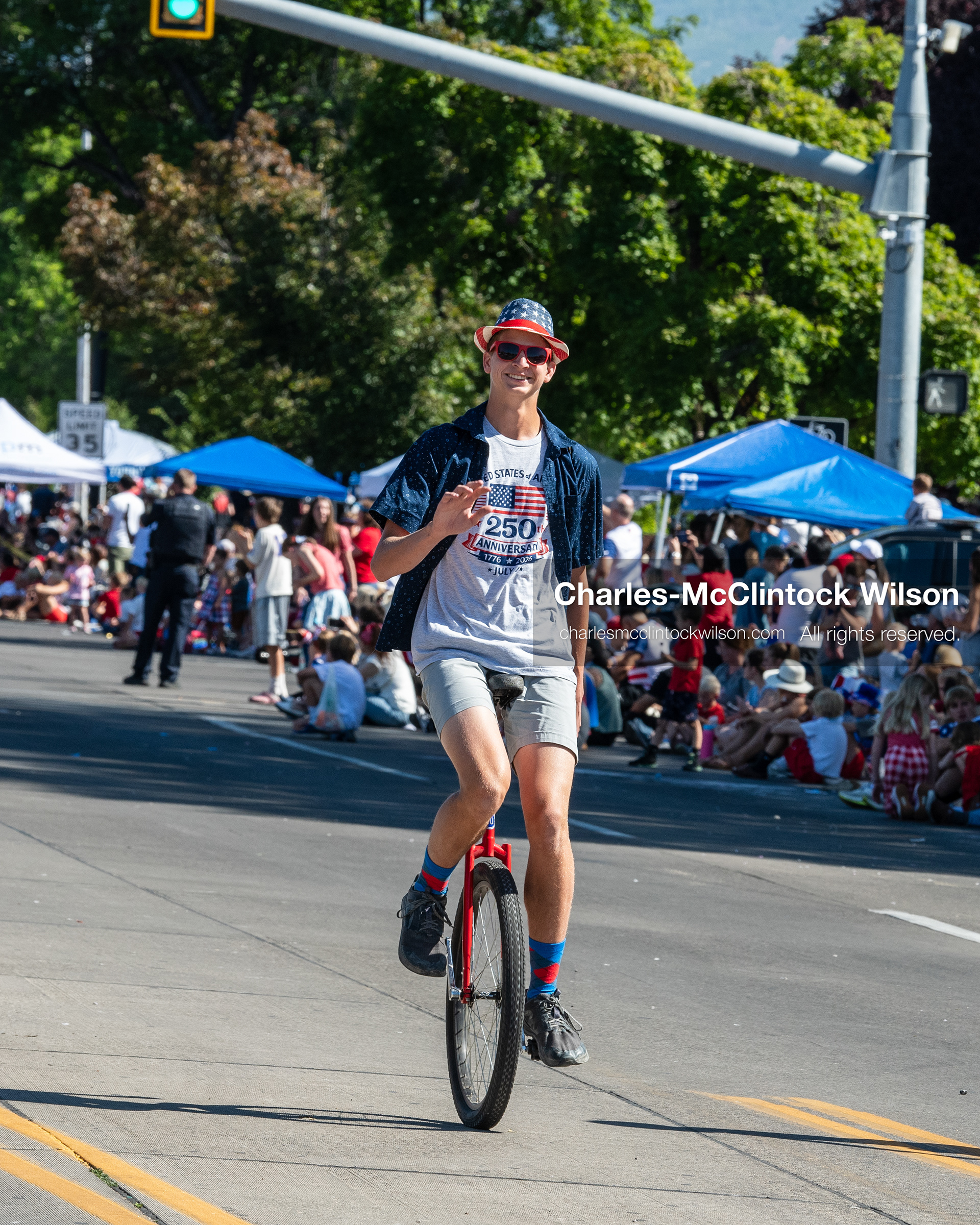 July 4, 2026, Provo, Utah, USA: A street performer rides a unicycle past crowds lining the parade route during America's Freedom Festival Grand Parade in Provo, Utah, Saturday, July 4, 2026. The annual event drew thousands of spectators to the downtown corridor. (Credit Image: © Charles-McClintock Wilson/ZUMA Press Wire)