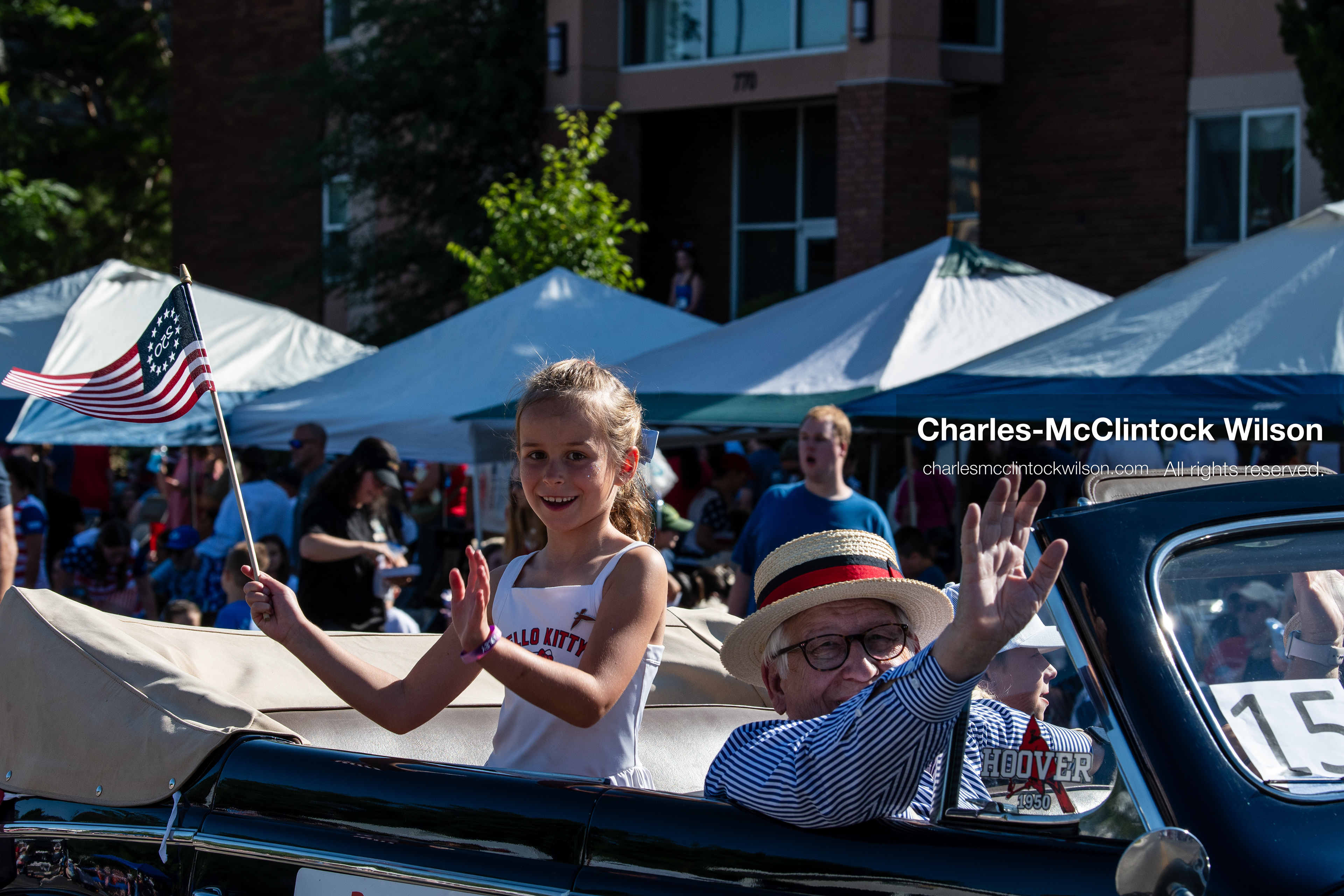 July 4, 2026, Provo, Utah, USA: Passengers wave to onlookers from the back of a classic convertible car during America's Freedom Festival Grand Parade in Provo, Utah, Saturday, July 4, 2026. The annual event drew thousands of spectators to the downtown corridor. (Credit Image: © Charles-McClintock Wilson/ZUMA Press Wire)